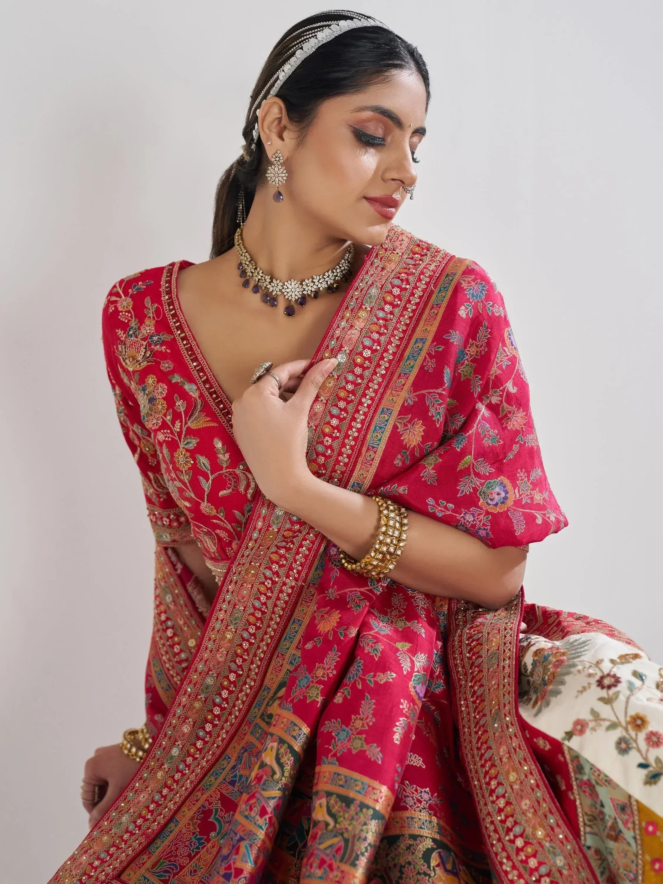 Red embroidered lehenga choli with floral patterns, traditional Indian ethnic wear for weddings and festivals