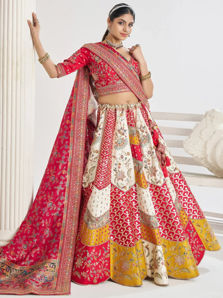 Red and gold embroidered lehenga choli with floral patterns, perfect for Indian weddings and festive occasions.