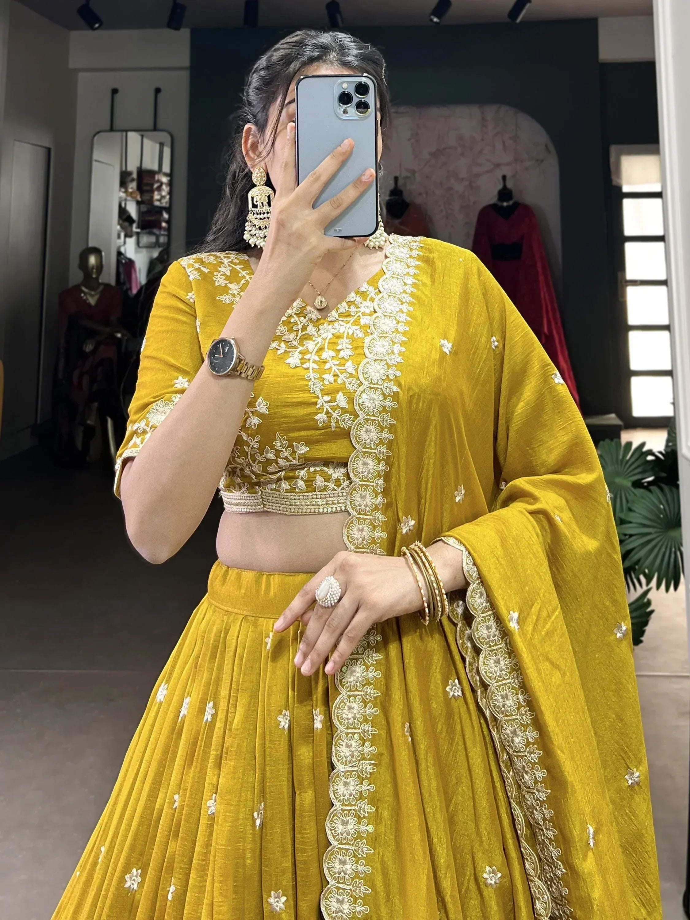 Yellow embroidered lehenga choli with floral detailing, perfect for Indian ethnic wear occasions.