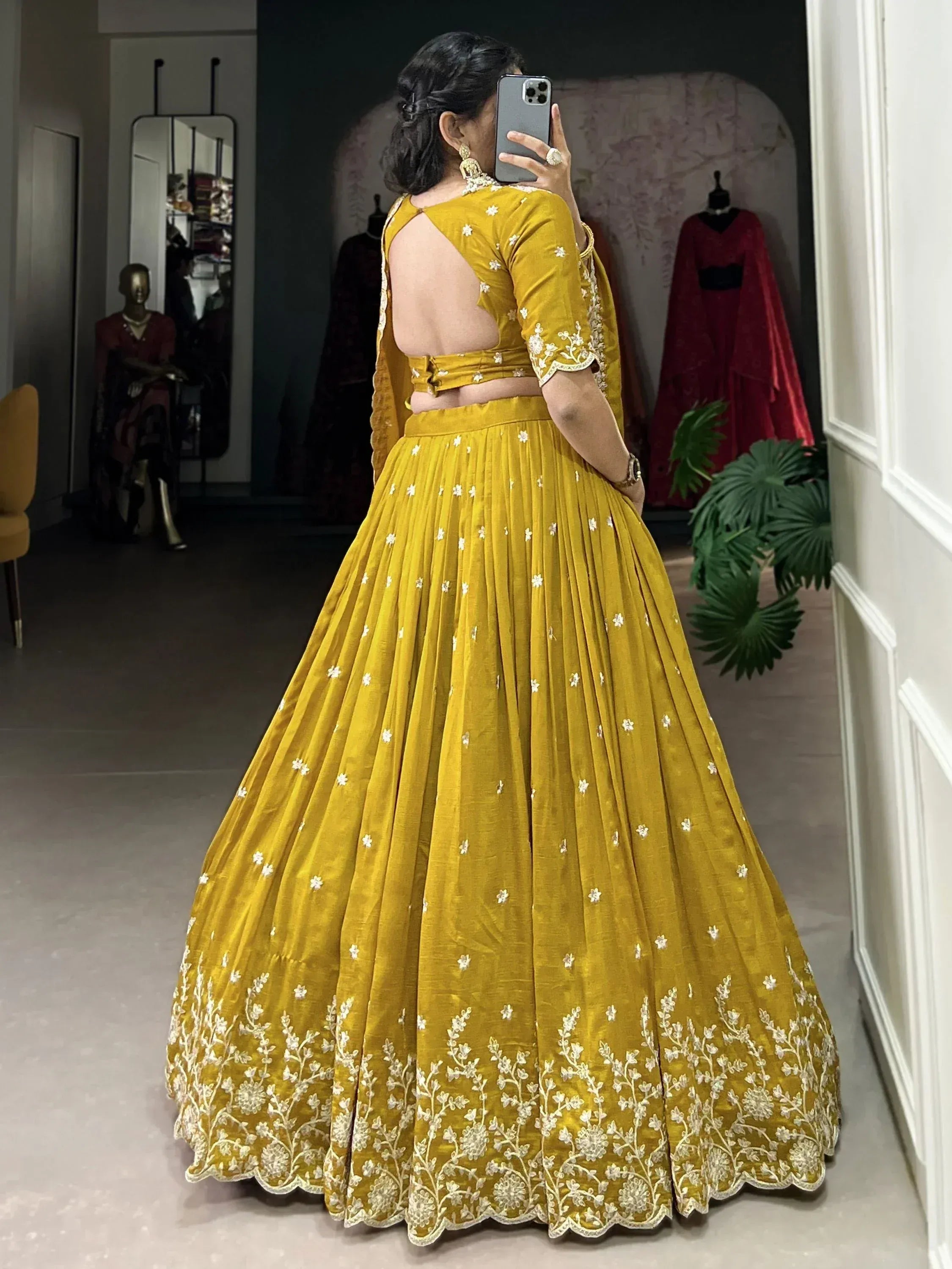 Mustard yellow lehenga choli with white floral embroidery, backless blouse, pleated skirt, ethnic wear