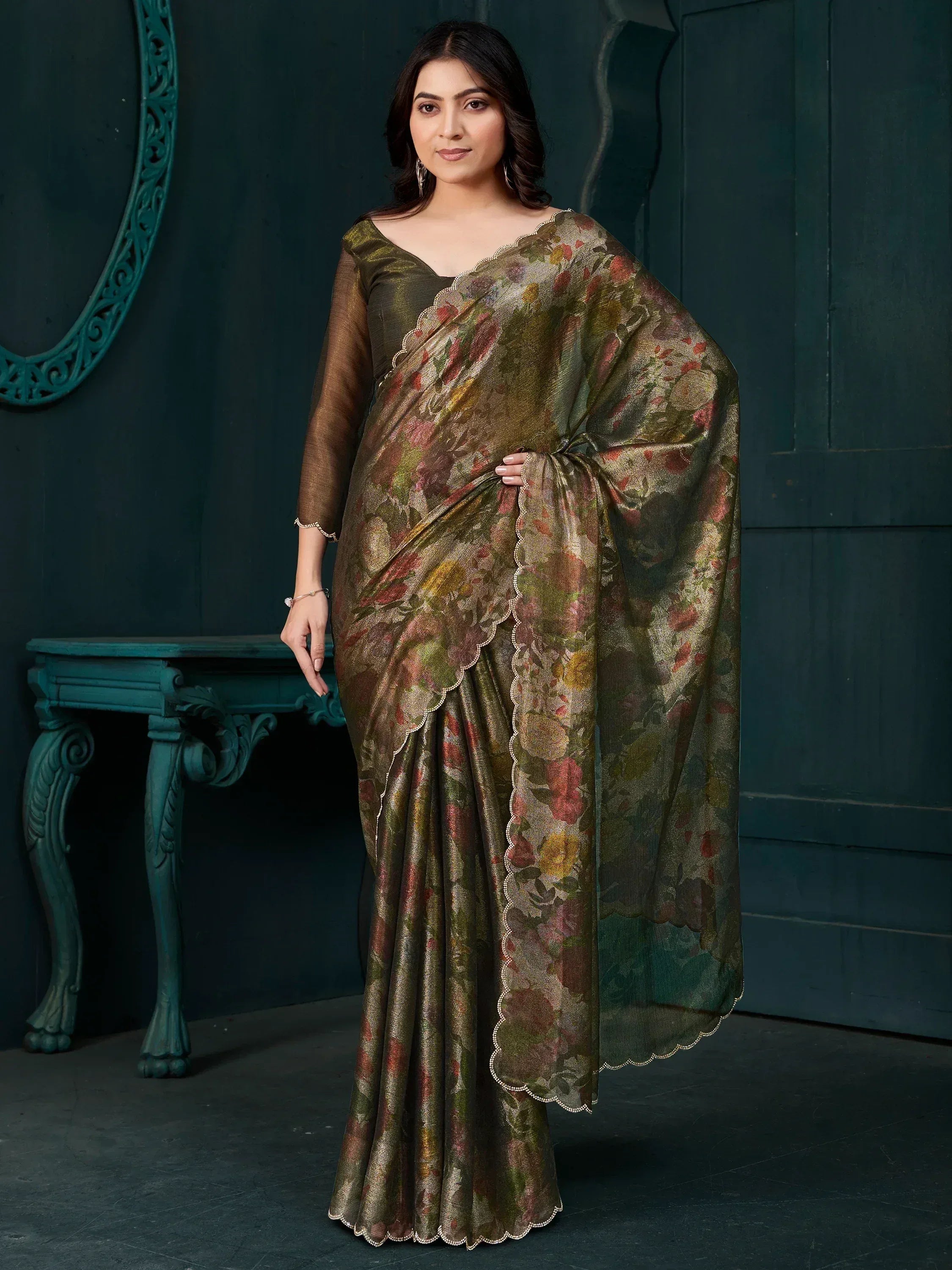 Elegant olive green floral saree with scalloped border, perfect for Indian ethnic wear occasions.