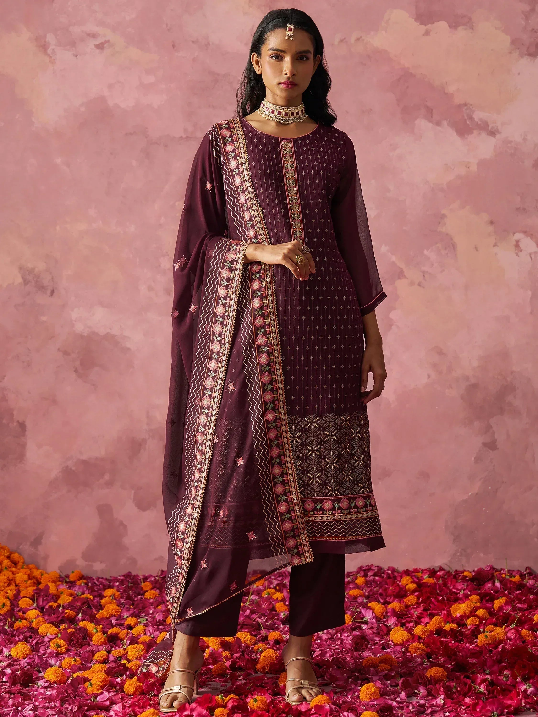Elegant maroon embroidered salwar kameez with floral dupatta, perfect for Indian ethnic occasions