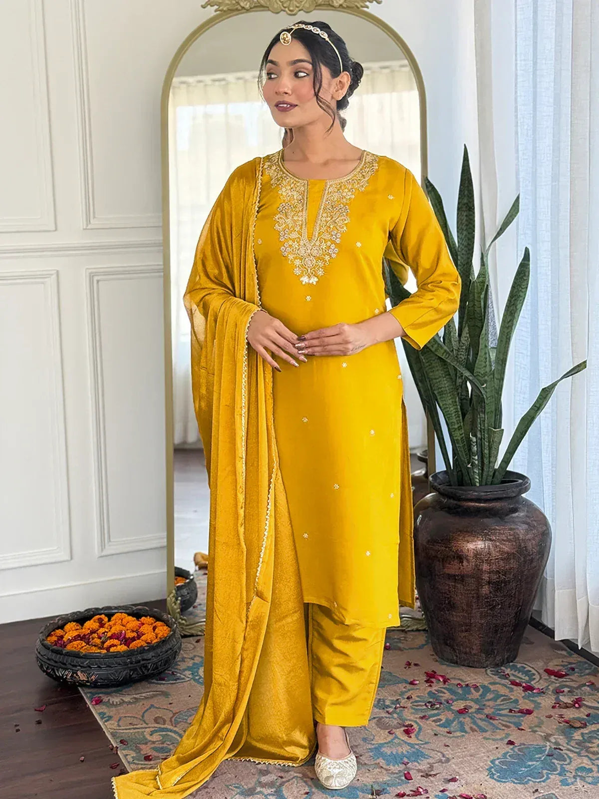 Yellow velvet ethnic salwar kameez with gold embroidery, perfect for festive occasions and traditional wear.