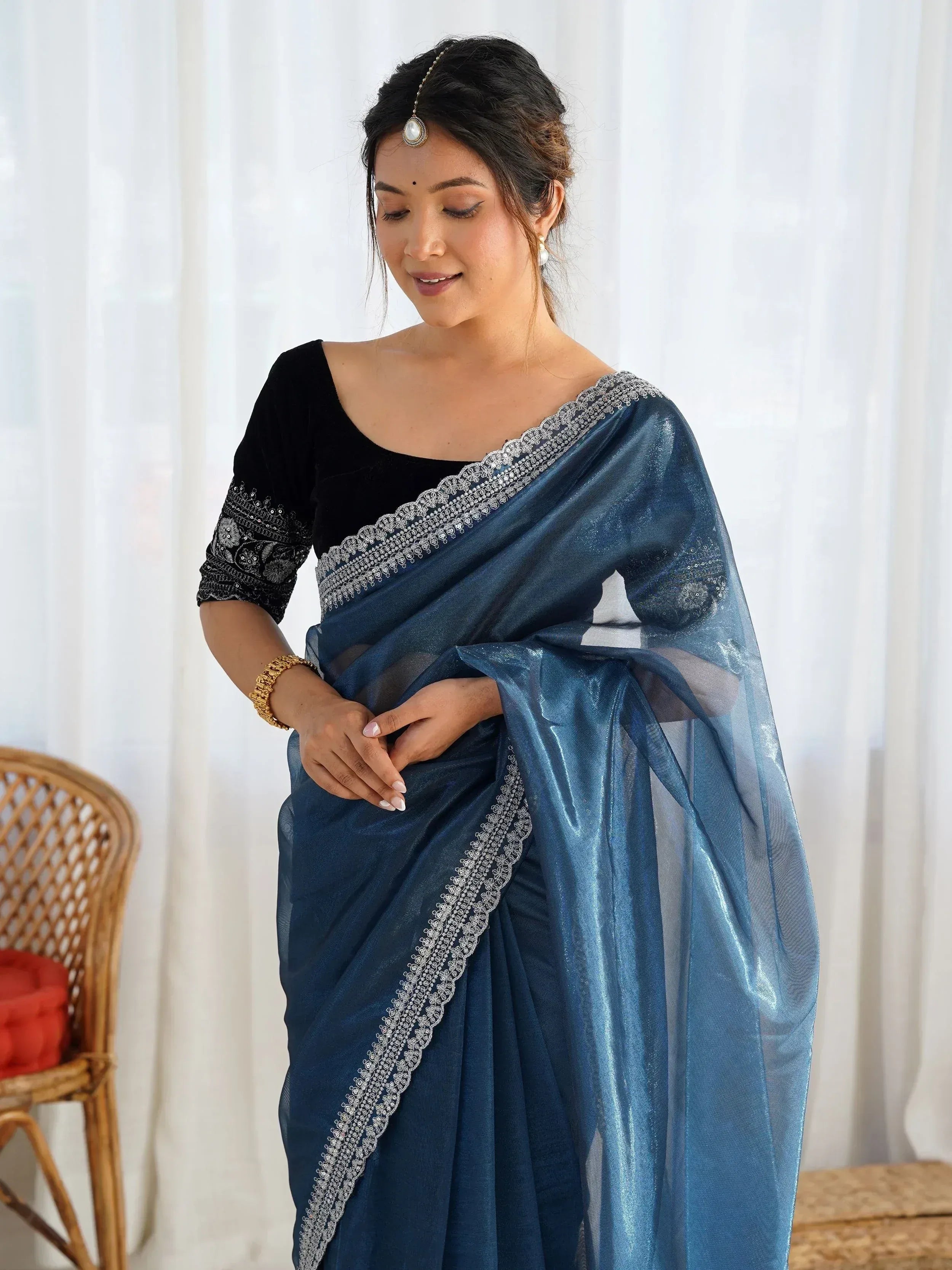 Woman in blue saree with silver embroidery and black velvet blouse, Indian ethnic wear