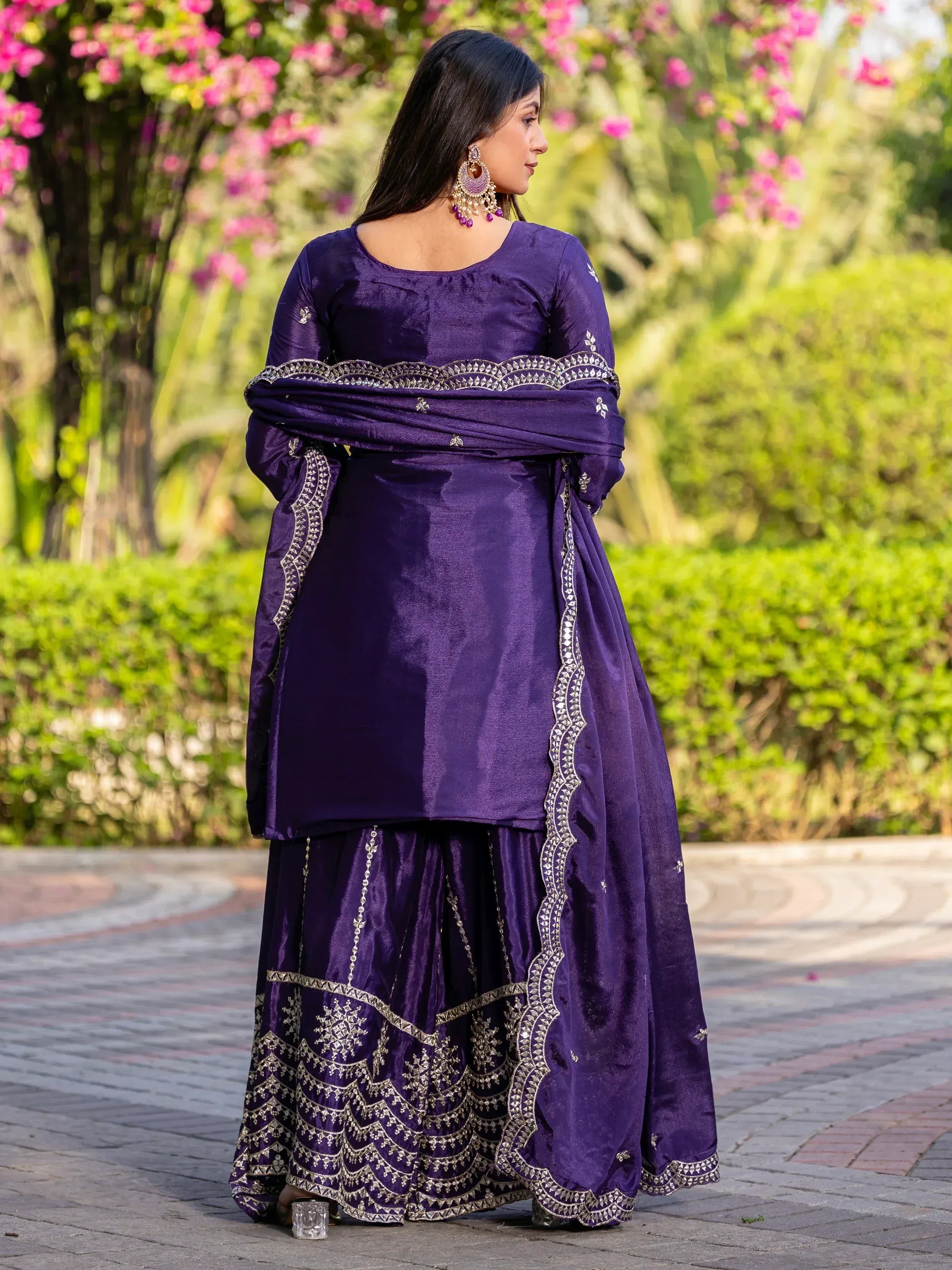 Purple ethnic salwar kameez with gold embroidery, perfect for Indian festive occasions and weddings.