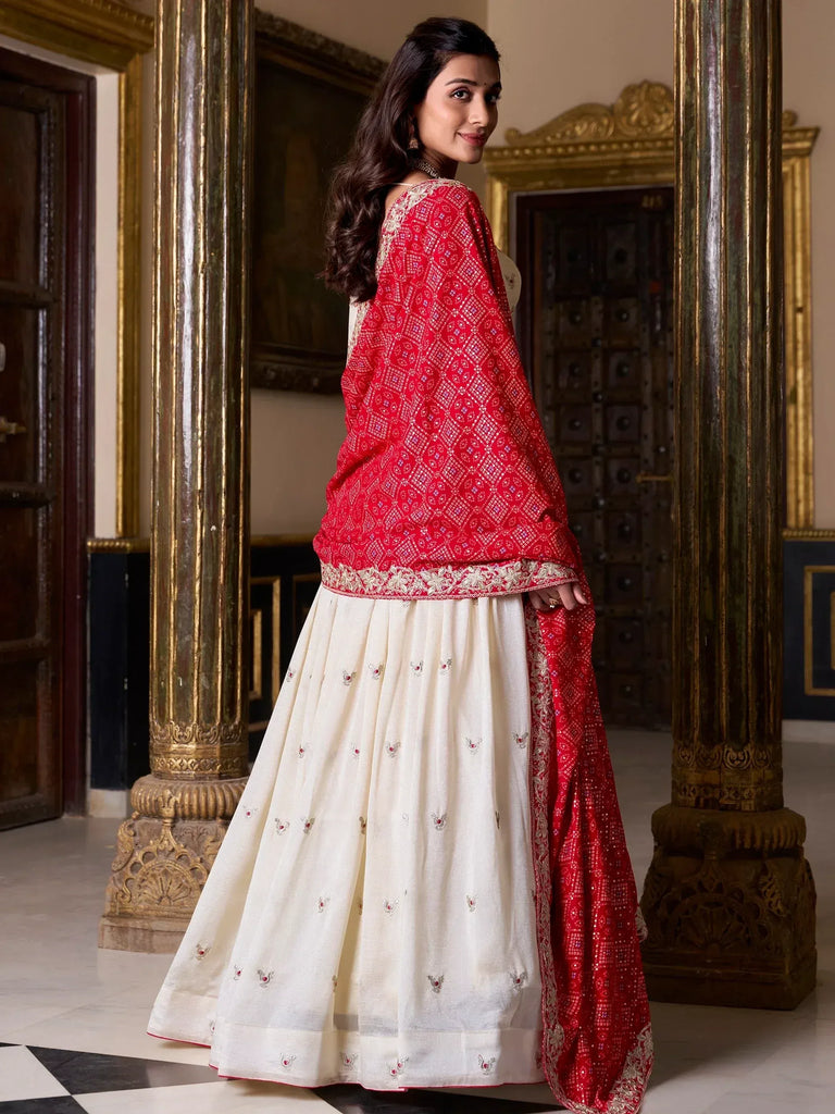 Red and cream embroidered lehenga choli with mirror work, perfect for Indian ethnic wear occasions