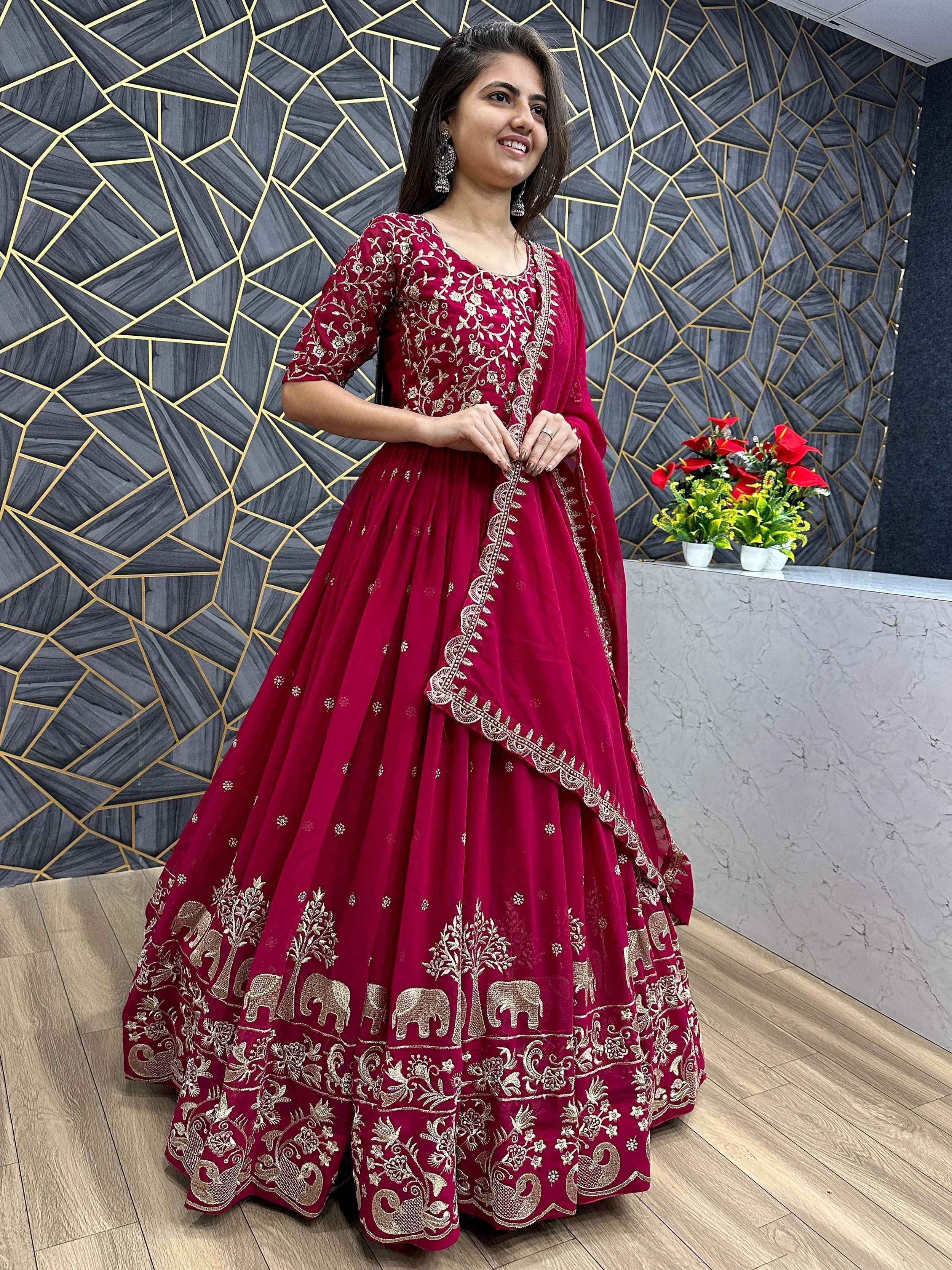 Maroon embroidered lehenga choli with elephant motifs, perfect for Indian ethnic wear and festive occasions.