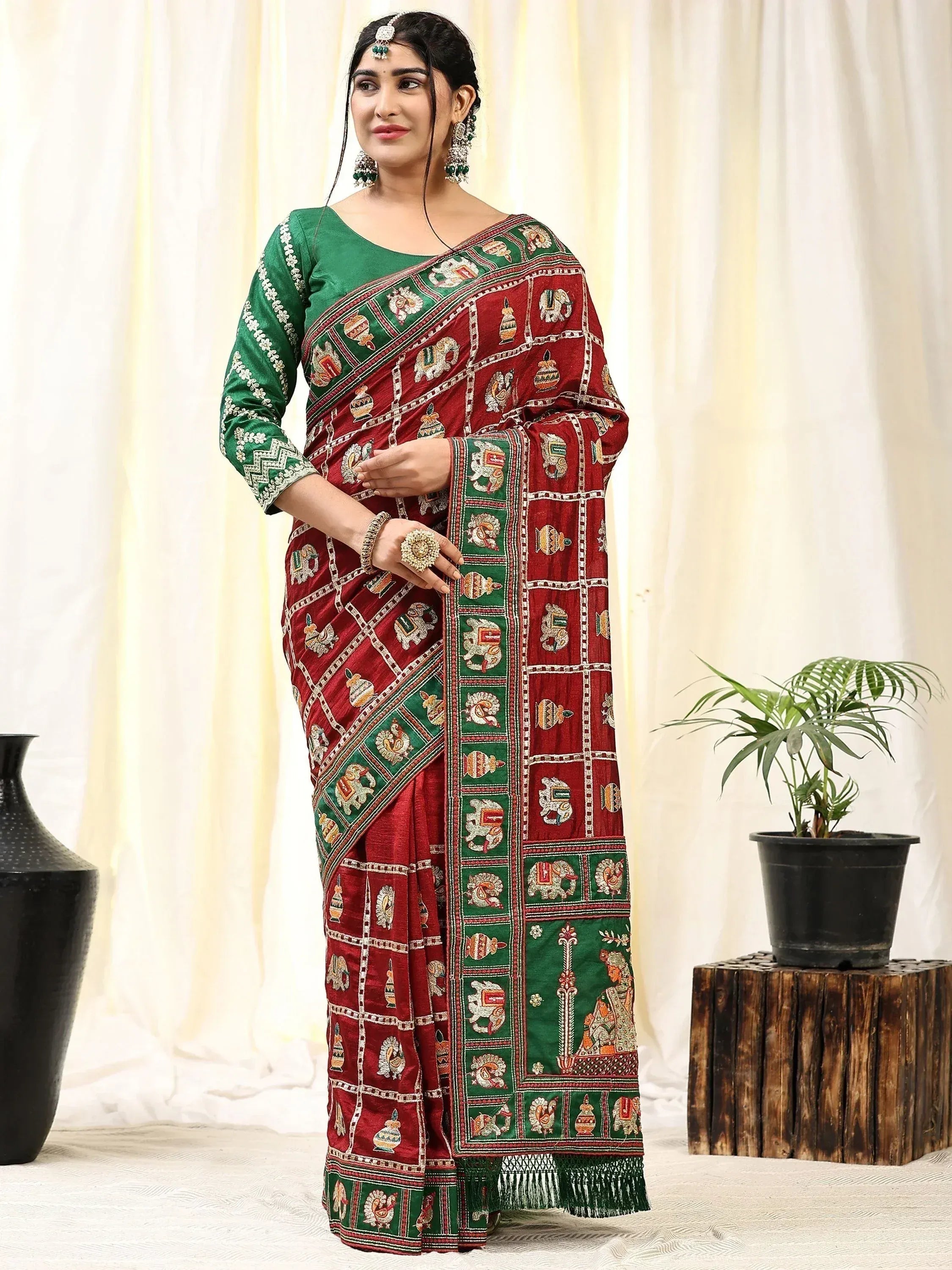 Red and green embroidered saree with elephant motifs, traditional Indian ethnic wear for women