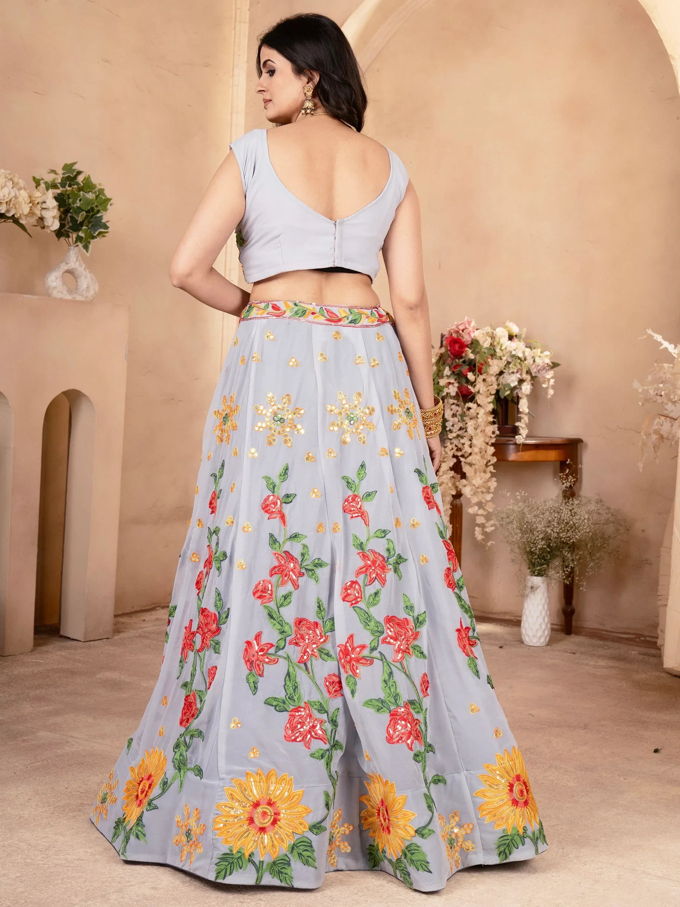 Light blue lehenga choli with floral embroidery, perfect for Indian ethnic wear occasions.