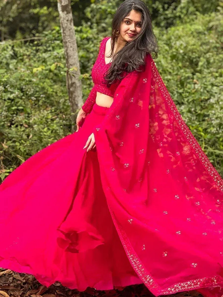 Vibrant red designer lehenga choli with embroidered dupatta, perfect for Indian ethnic occasions