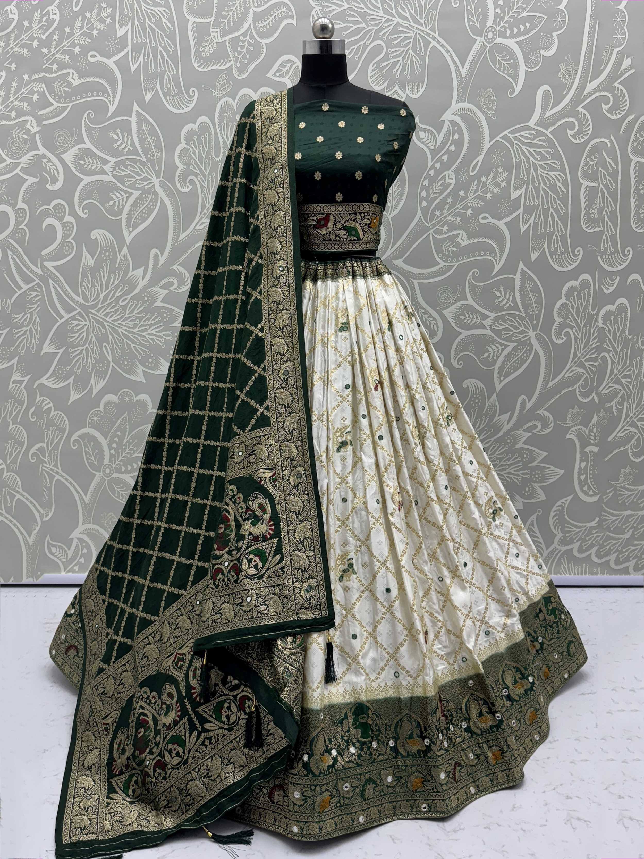 Emerald green and cream designer lehenga choli with intricate gold embroidery and matching dupatta
