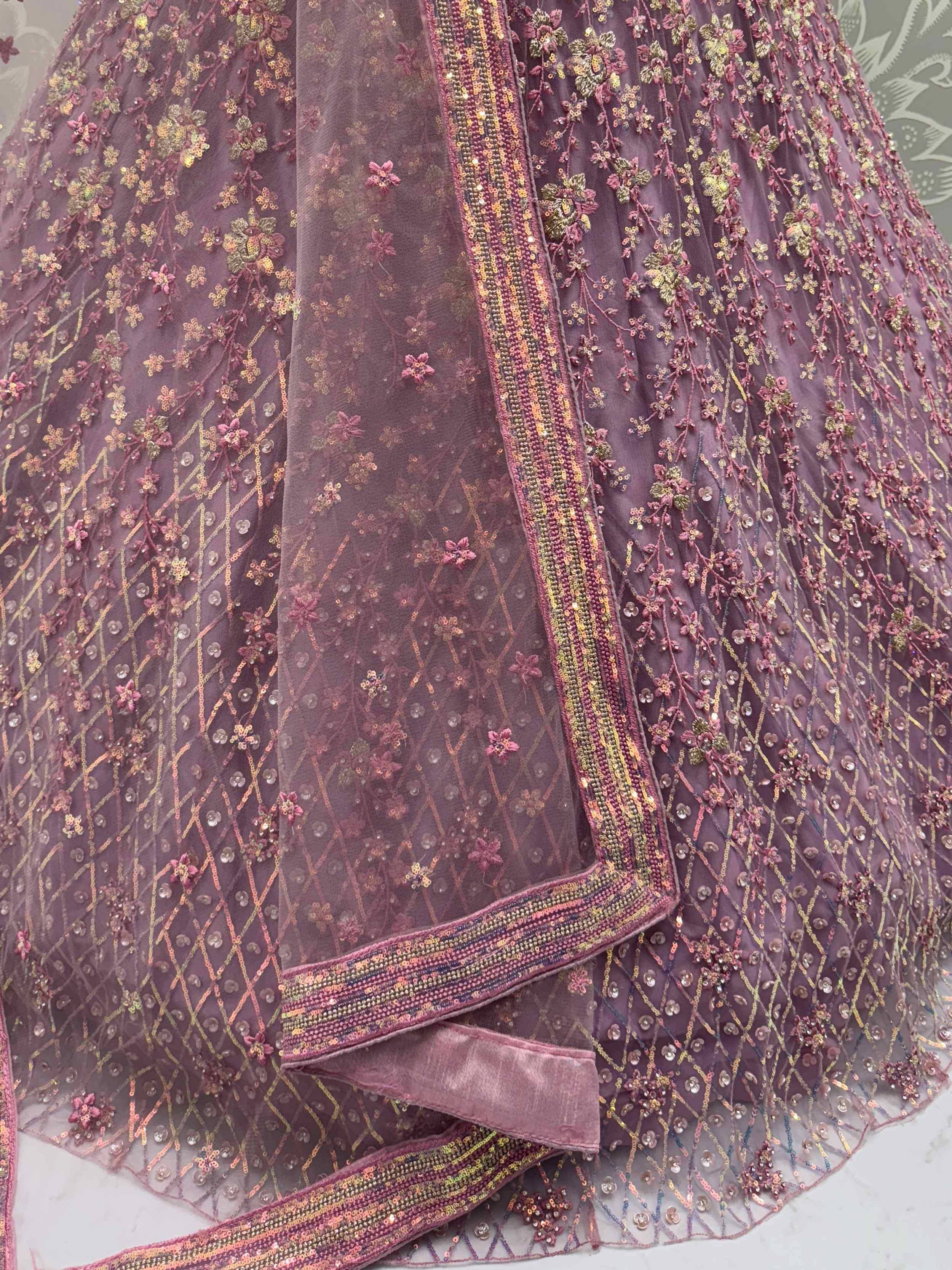 Elegant purple lehenga with floral embroidery and sequin detailing, perfect for Indian ethnic wear.