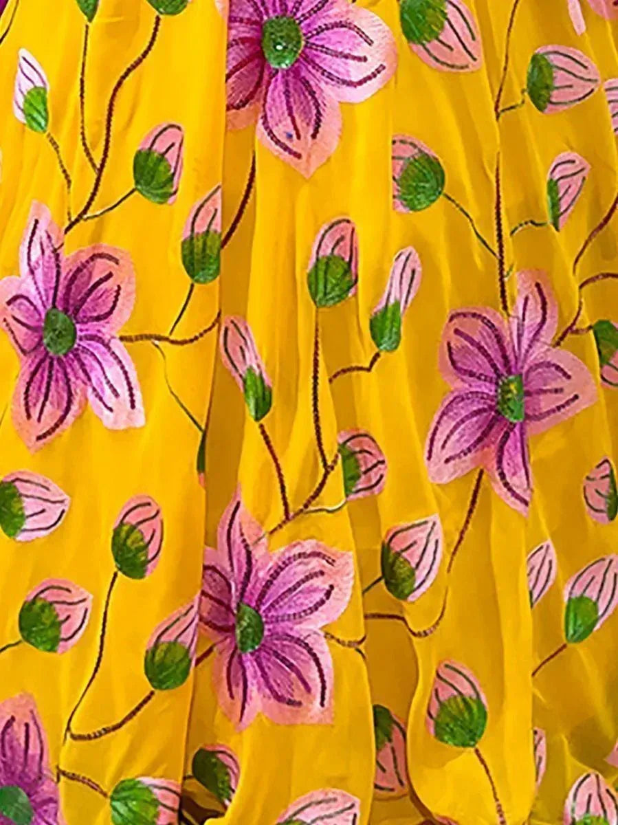 Yellow ethnic gown with hand-painted pink floral print, perfect for Indian occasions