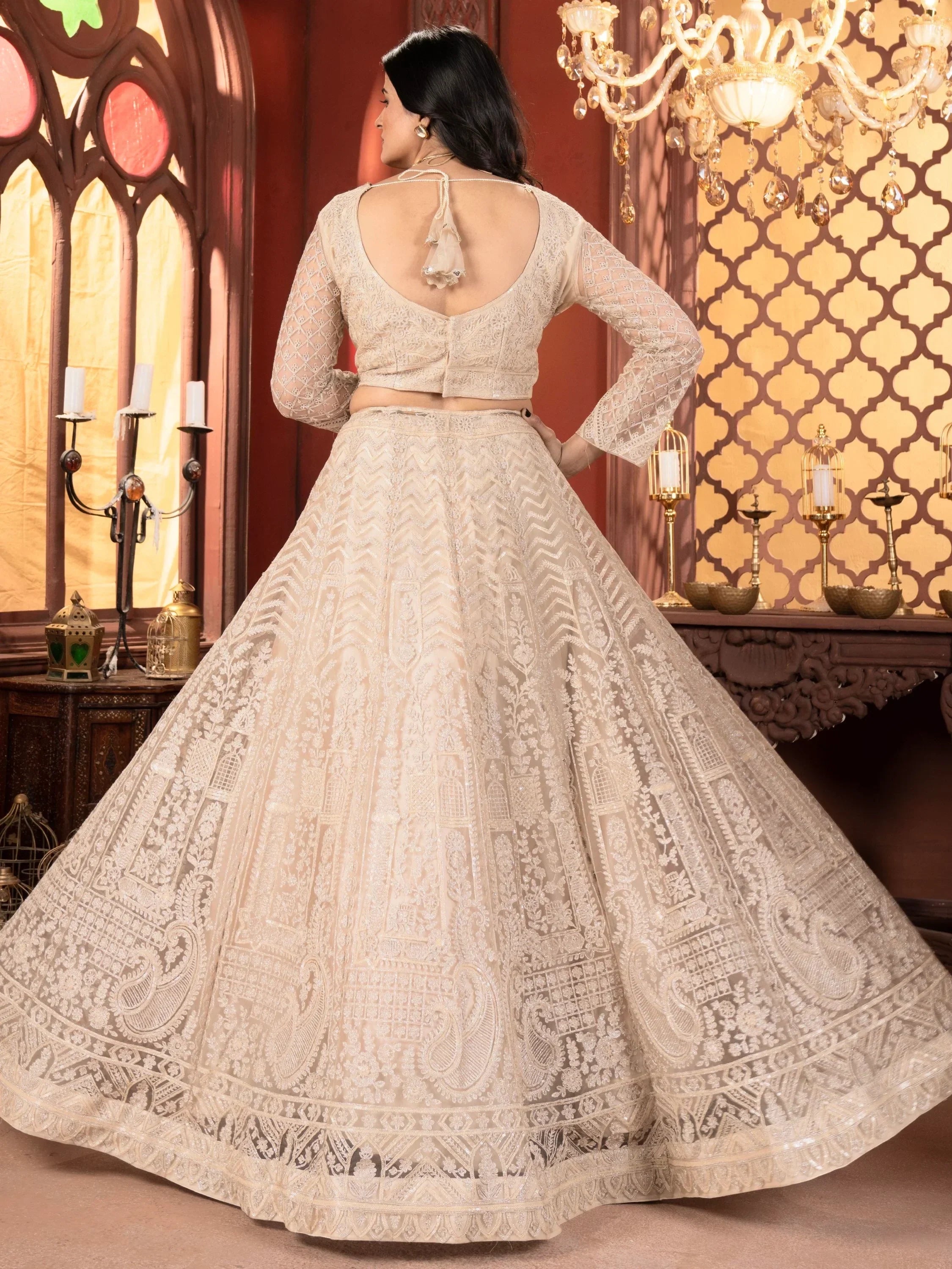 Elegant beige embroidered lehenga choli with back tie blouse, perfect for Indian weddings and festive occasions.