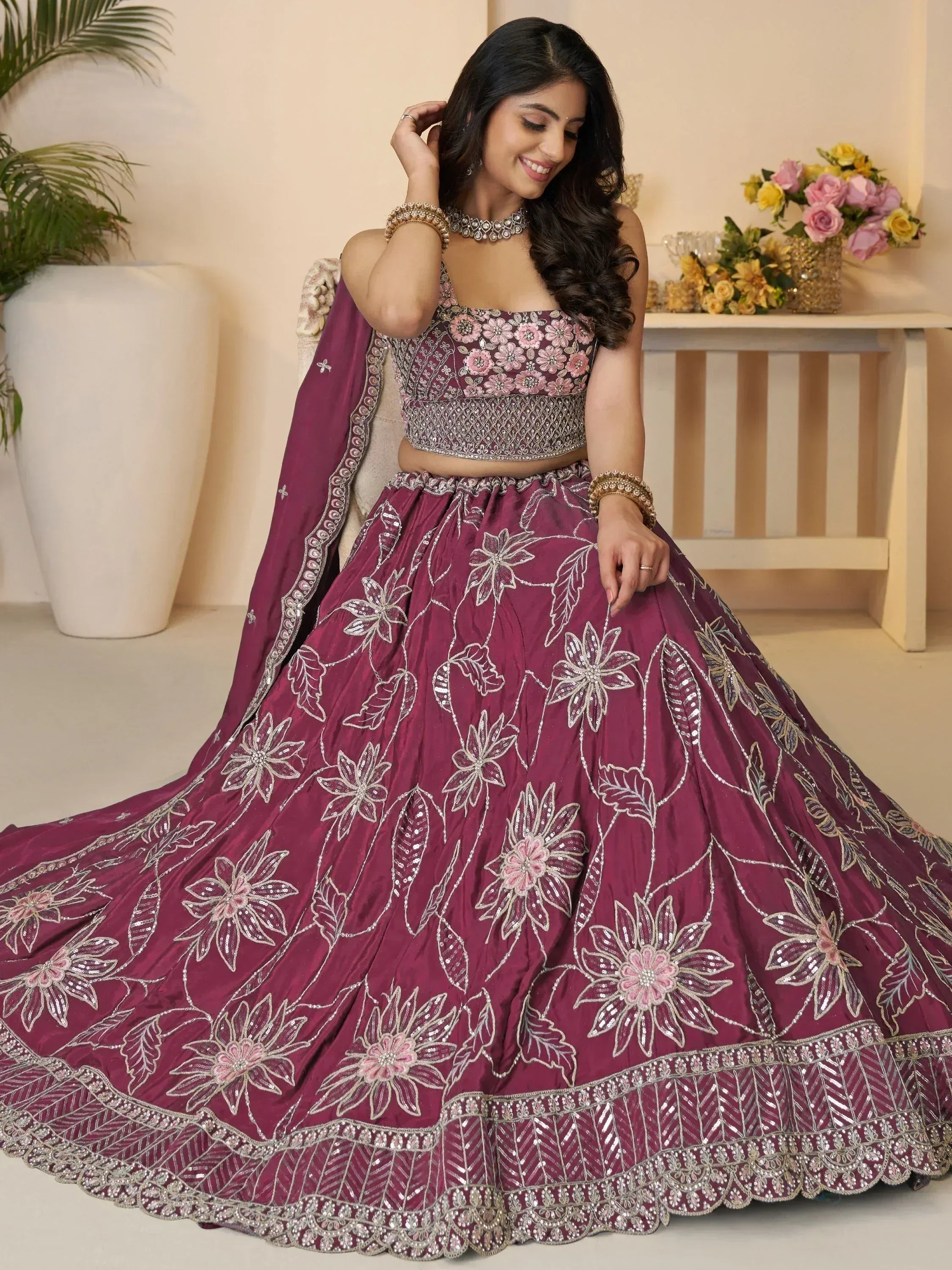 Elegant maroon lehenga choli with floral embroidery and silver detailing for Indian ethnic wear