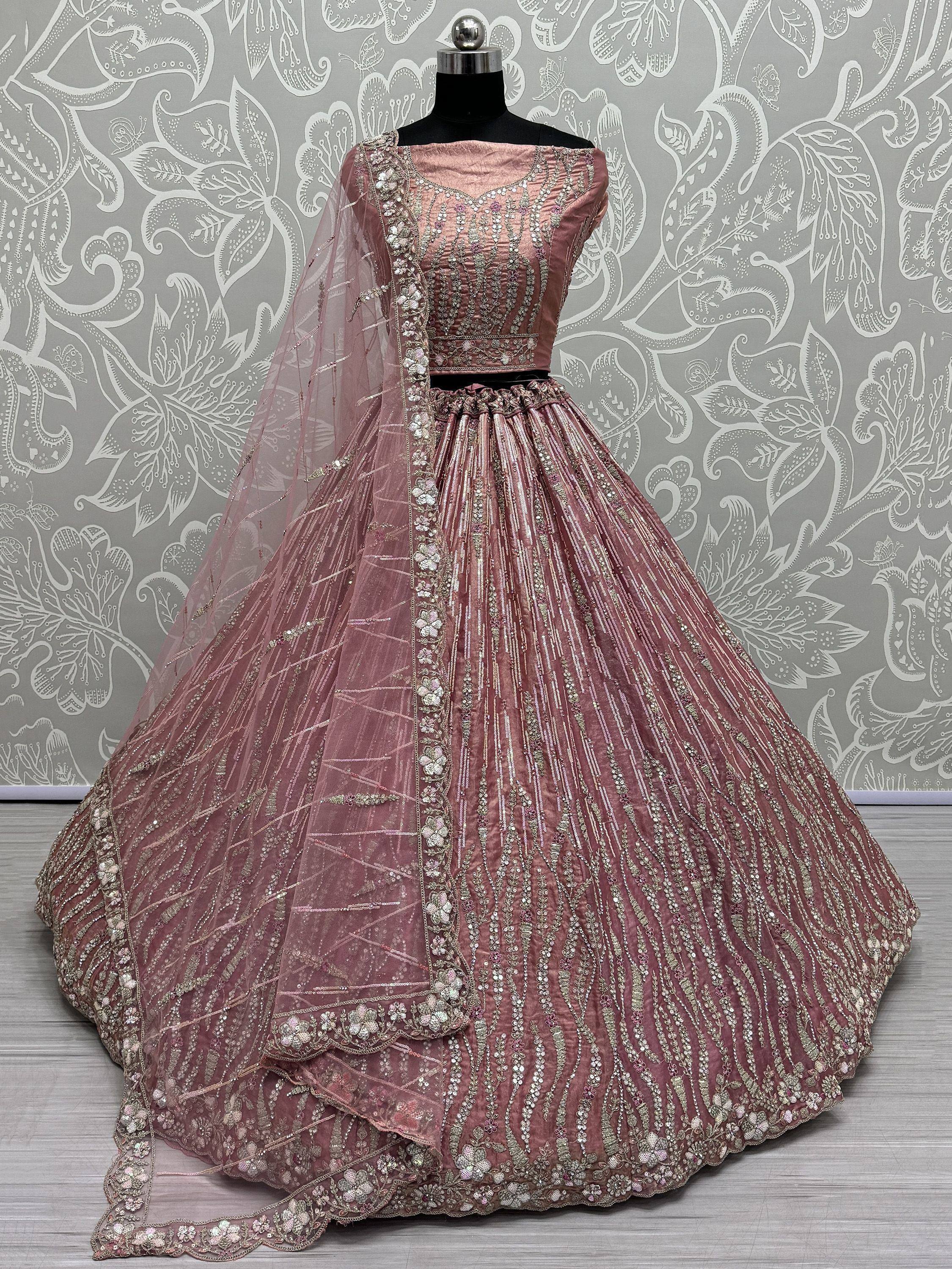 Dusty pink designer lehenga choli with heavy embroidery and sheer dupatta, ethnic Indian wear