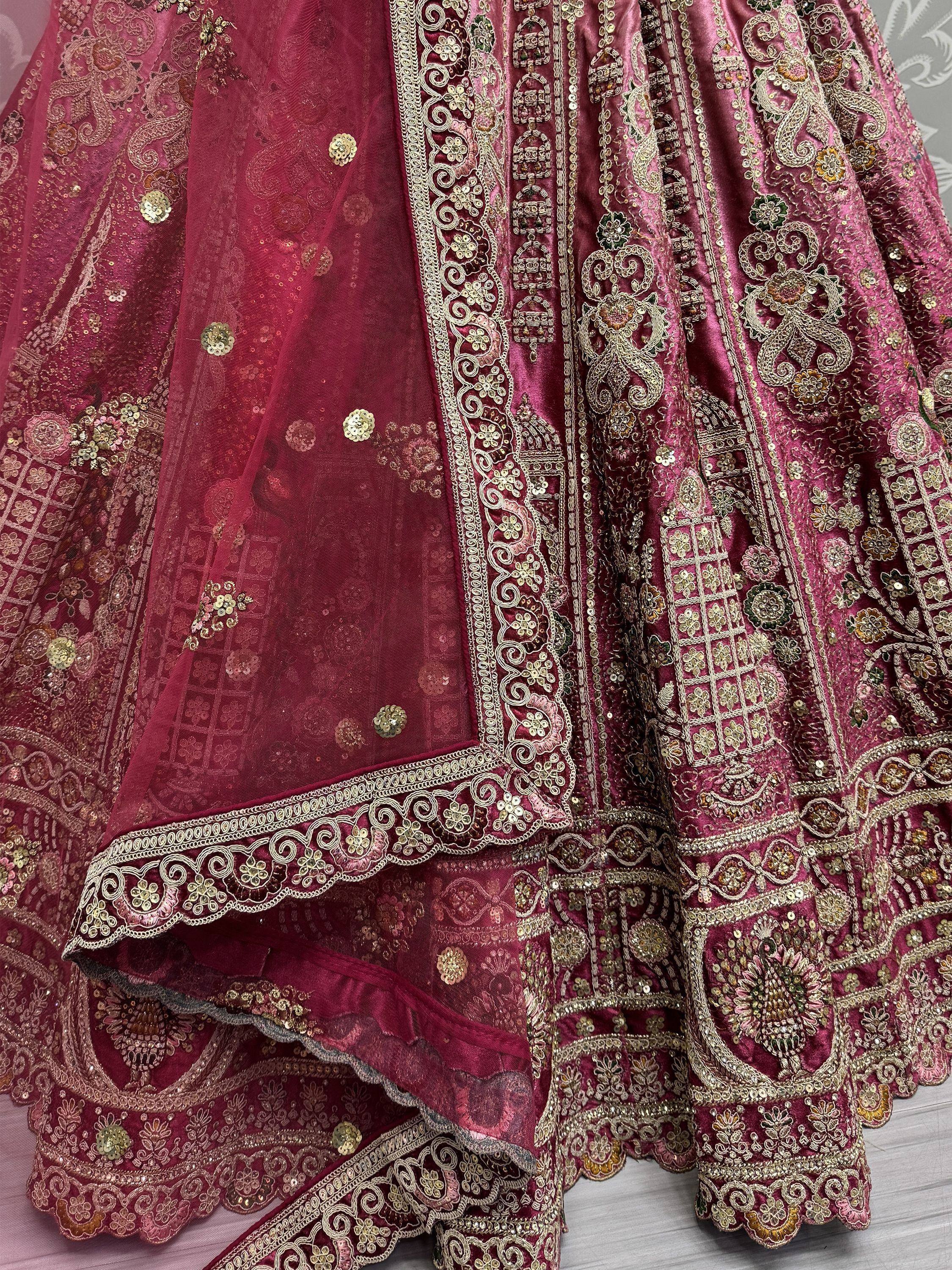 Luxury maroon lehenga choli with heavy gold embroidery and sequin work, perfect for weddings and festivals