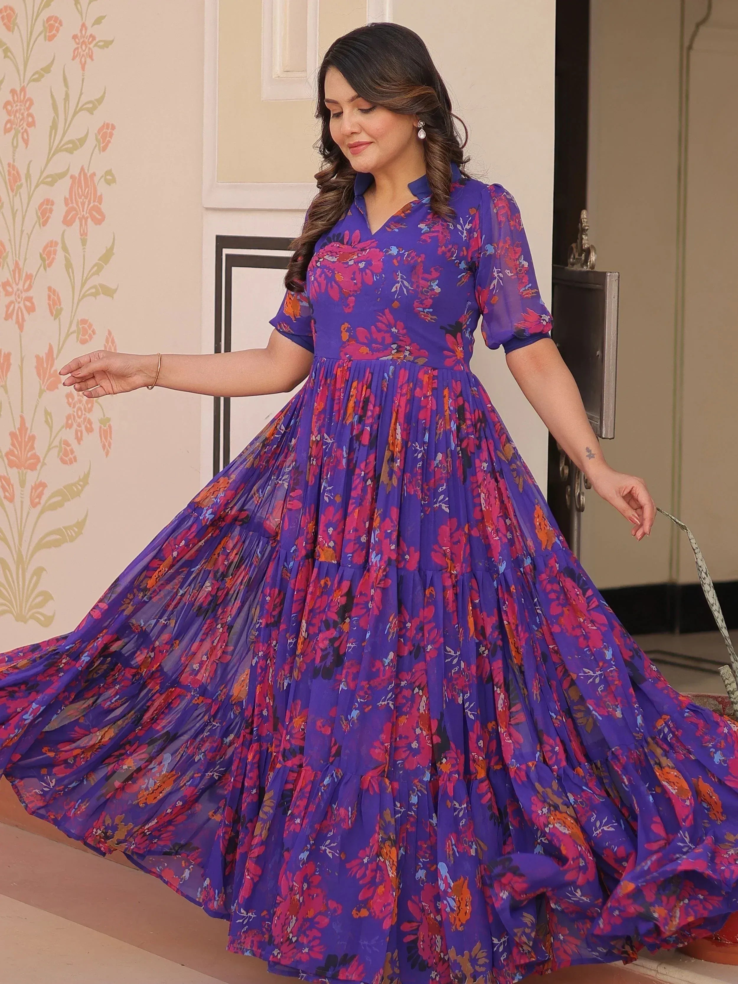 Purple floral ethnic gown with pleated skirt, perfect for Indian occasions and festive wear.