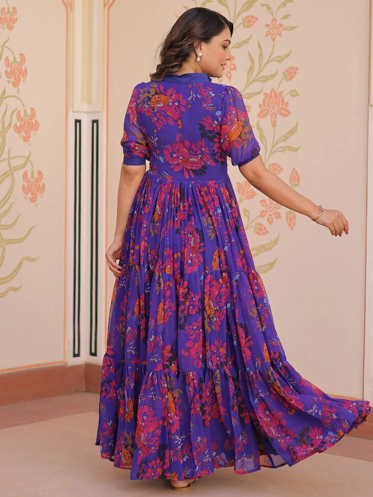 Purple floral ethnic gown with tiered skirt and puff sleeves, perfect for Indian occasions