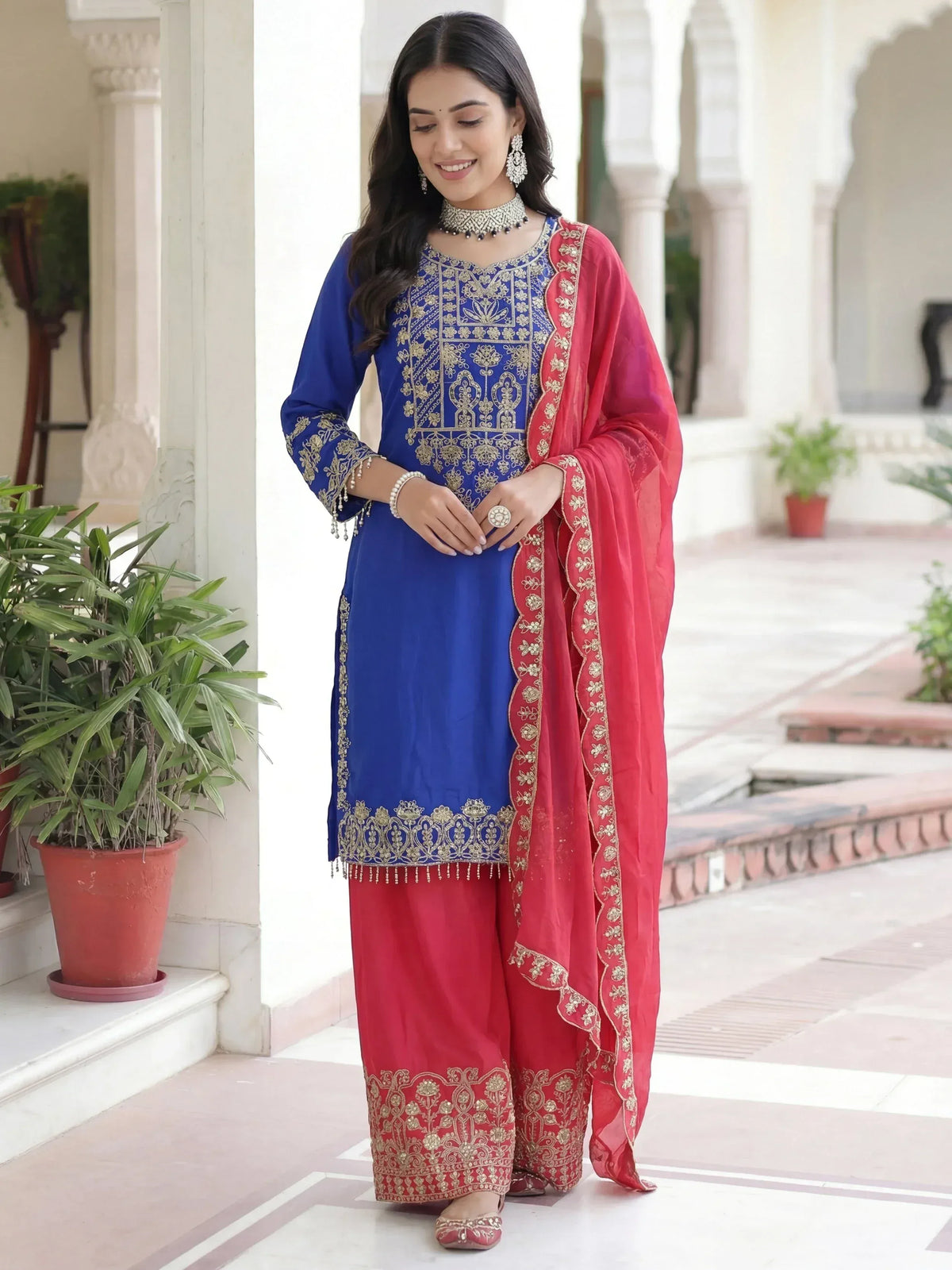 Blue and red embroidered salwar kameez with gold detailing, perfect for Indian ethnic wear occasions
