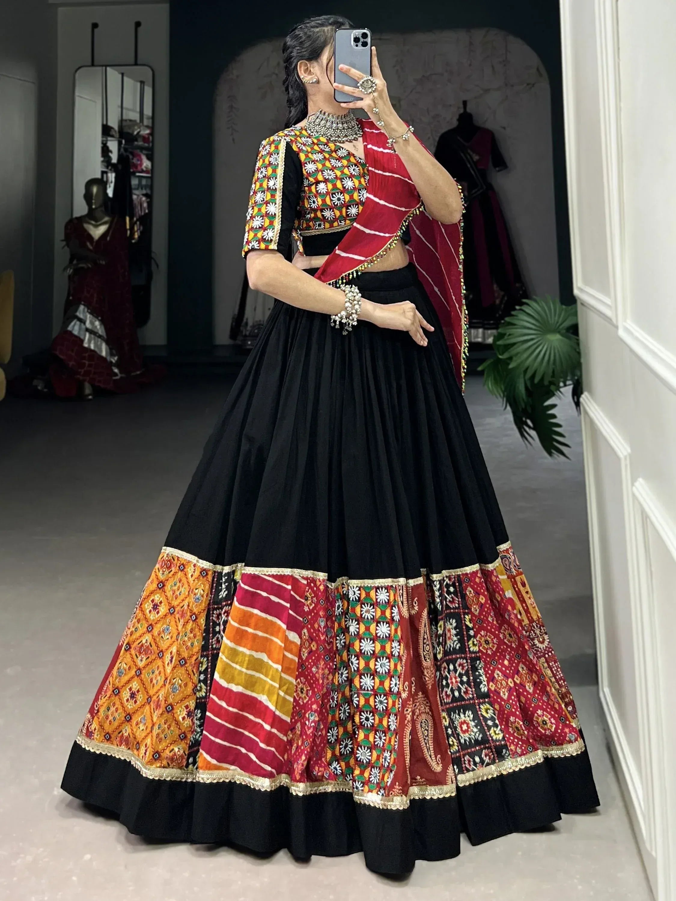 Black lehenga choli with colorful embroidered border and red dupatta, Indian ethnic wear