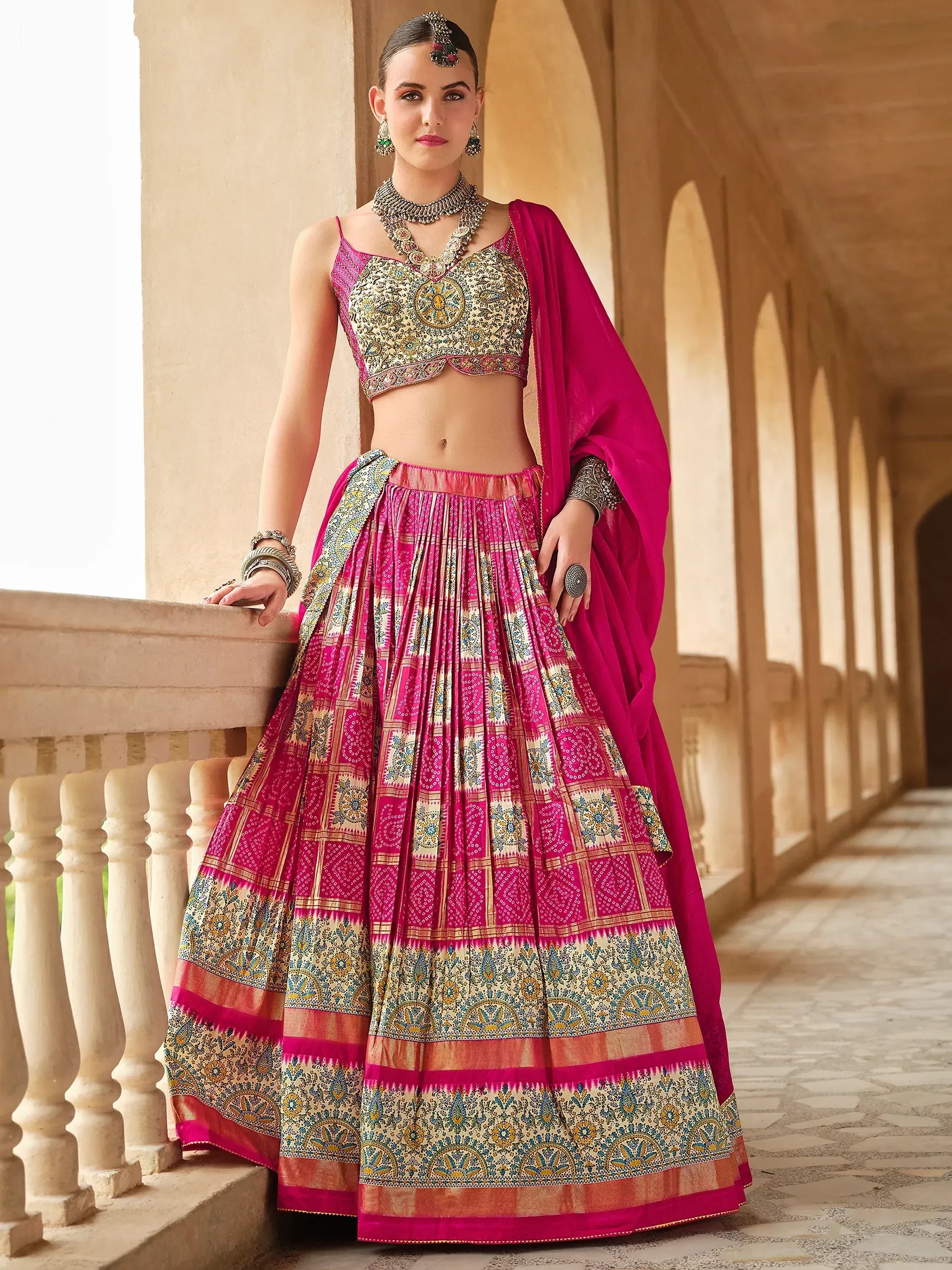 Pink and gold embroidered lehenga choli with dupatta, traditional Indian ethnic wear for weddings and festivals