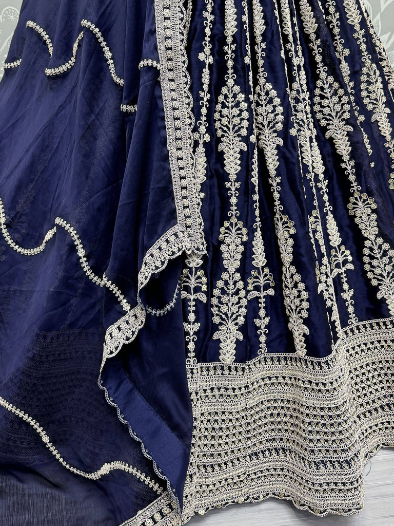 Navy blue lehenga with intricate gold floral embroidery and detailed border work