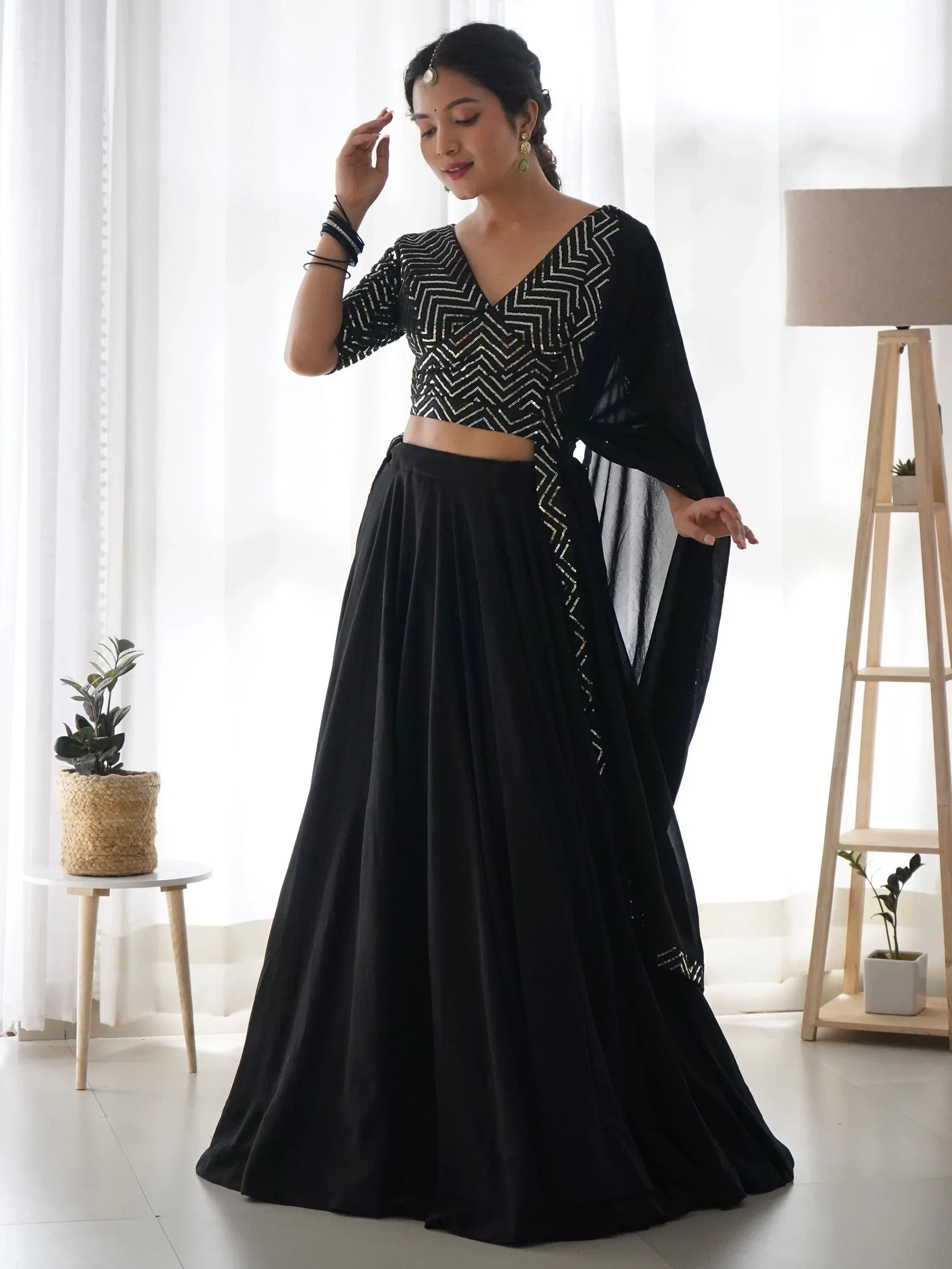 Black designer lehenga choli with geometric sequin work, perfect for Indian ethnic wear events