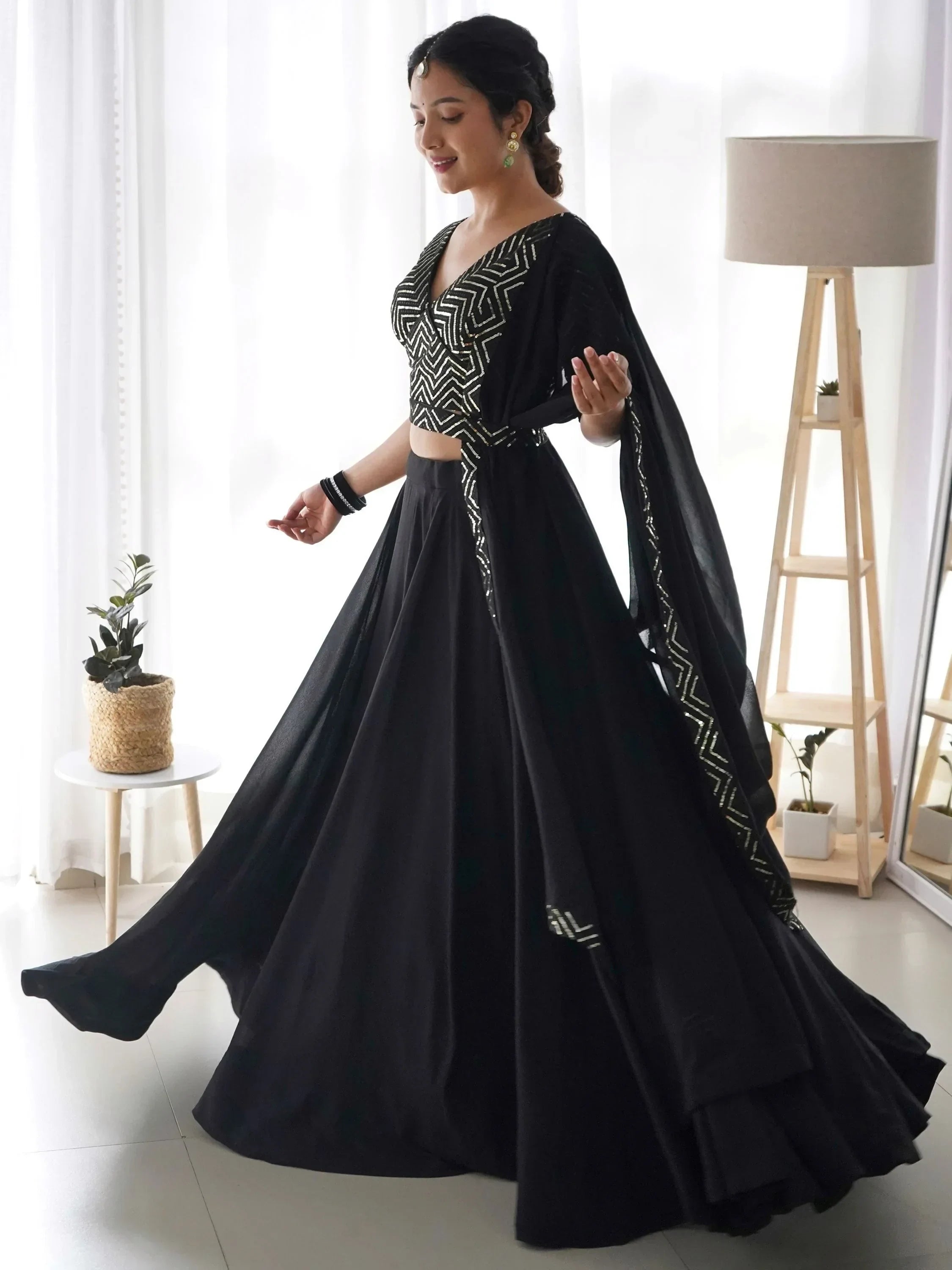 Black designer lehenga choli with geometric embroidery, perfect for Indian ethnic wear events