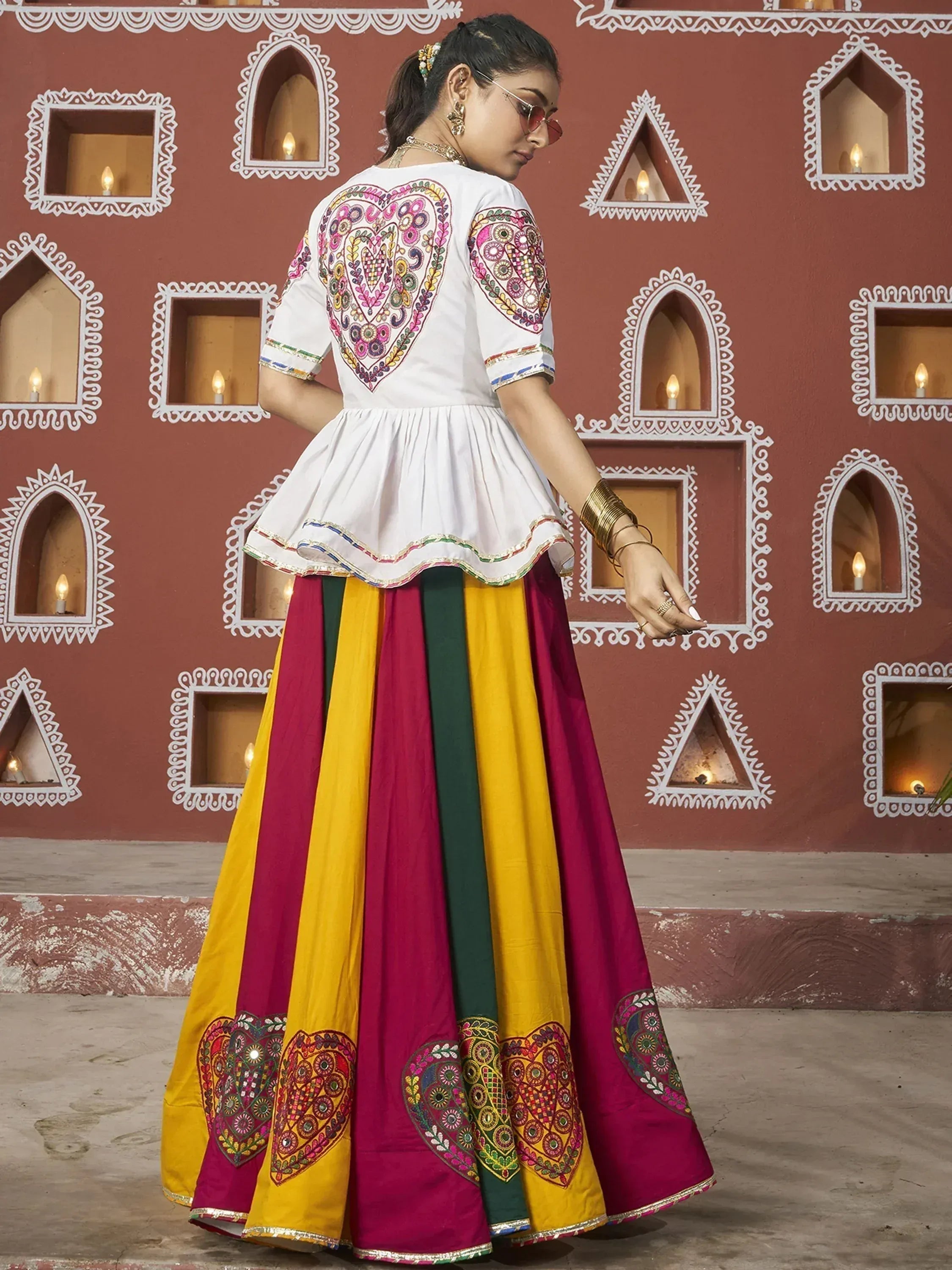 White embroidered top with colorful striped lehenga, Indian ethnic wear for women