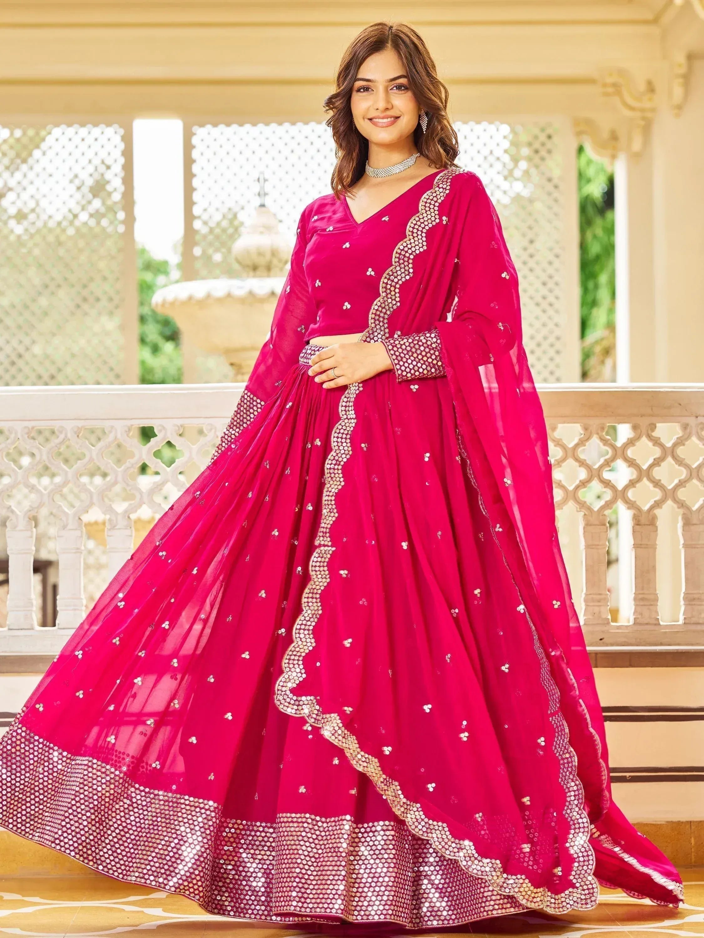 Fuchsia designer lehenga choli with sequin embroidery, perfect for Indian weddings and festive occasions.