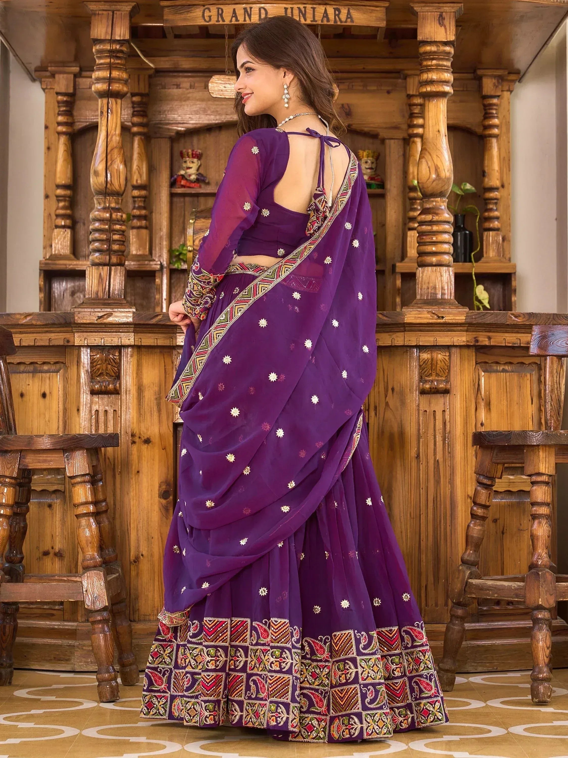 Purple embroidered lehenga choli with floral border, back view, ethnic Indian wear
