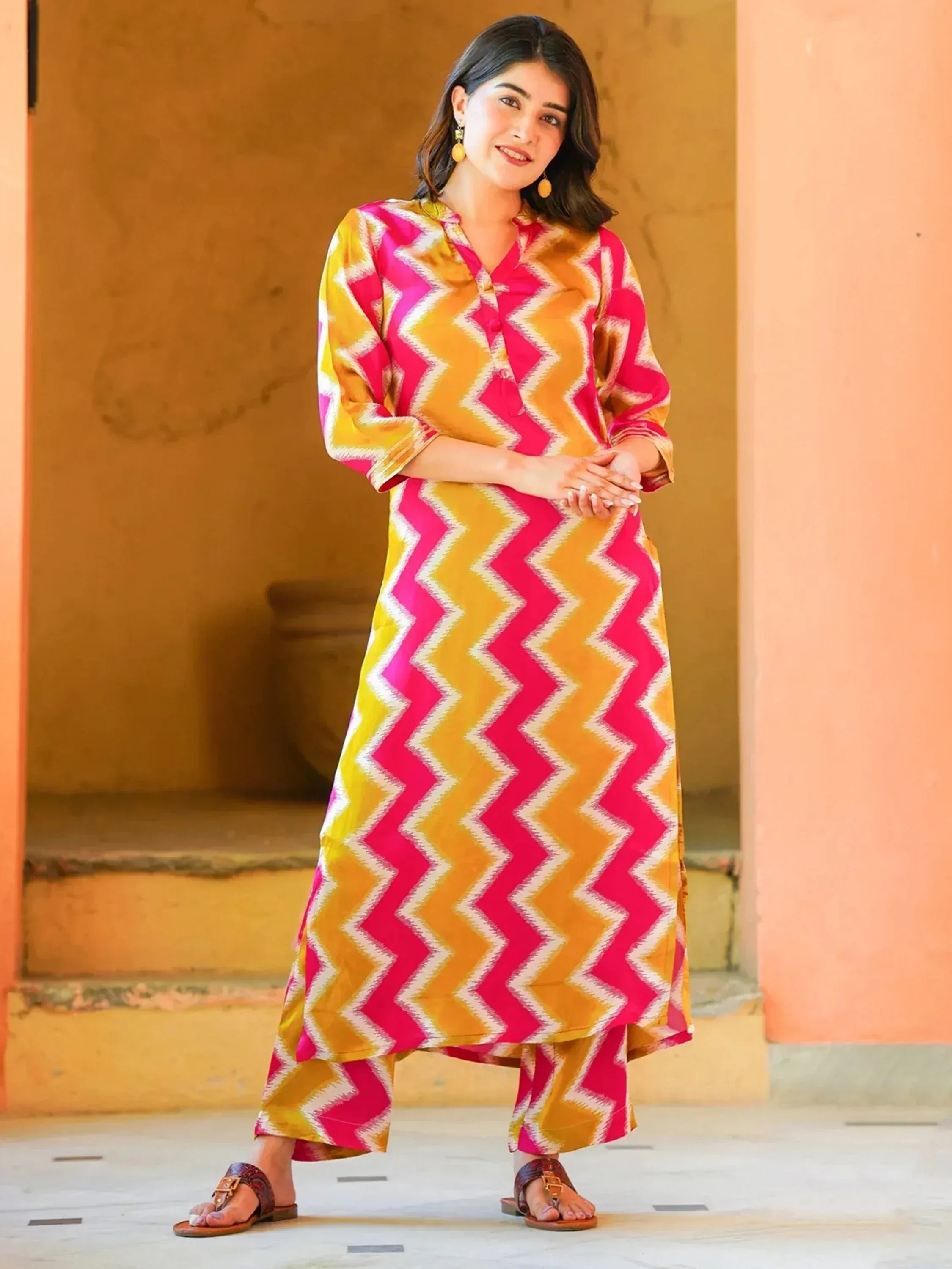 Woman in vibrant pink and yellow zigzag print ethnic kurta set with palazzo pants