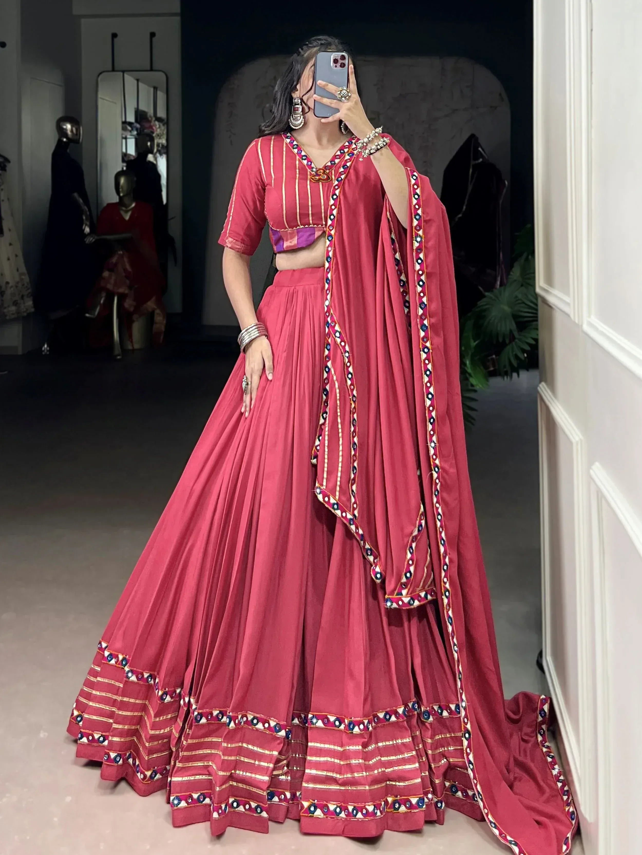 Pink embroidered lehenga choli with mirror work, perfect for Indian ethnic wear and festive occasions.