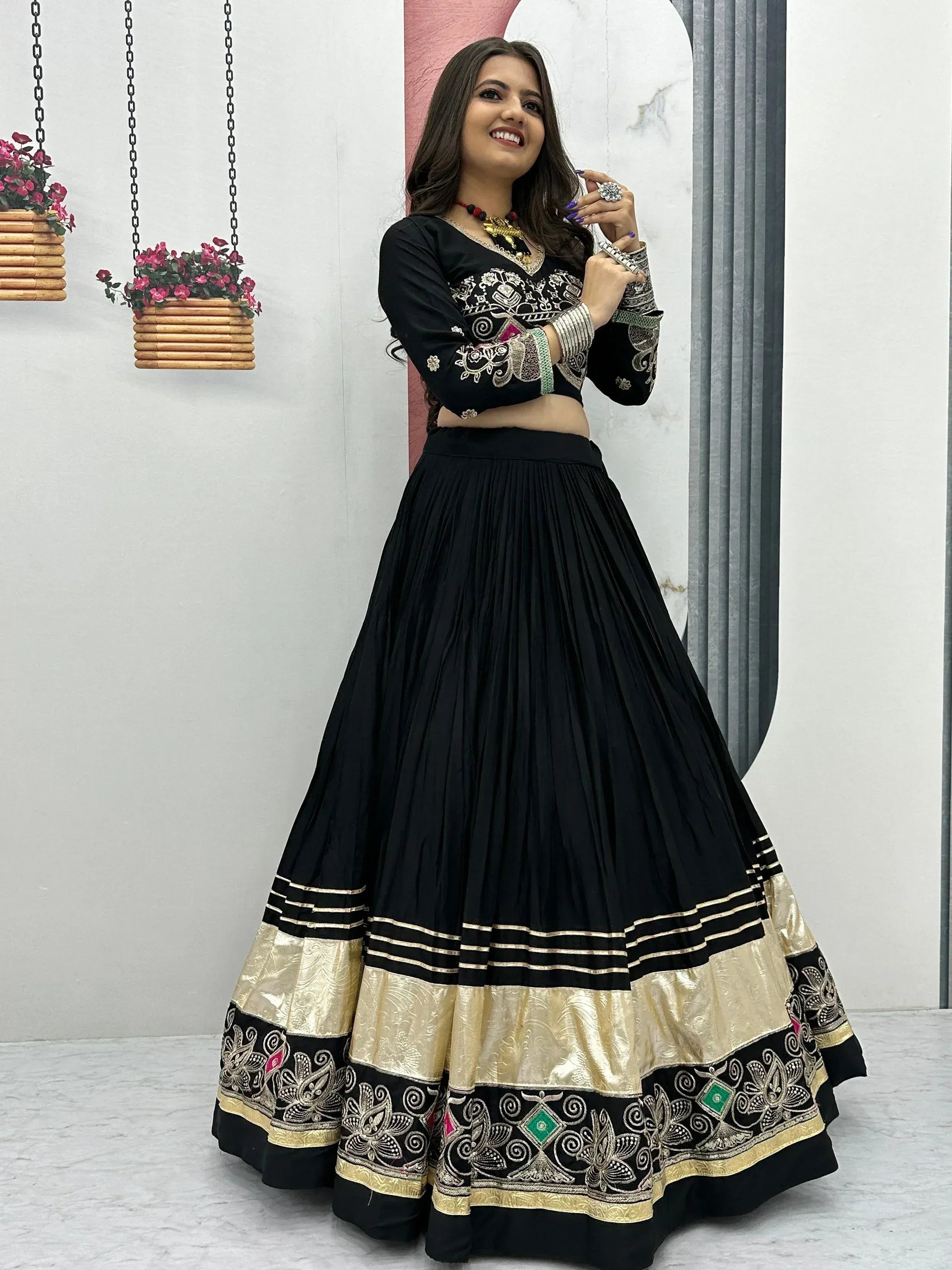Black embroidered lehenga choli with gold border, Indian ethnic wear for women