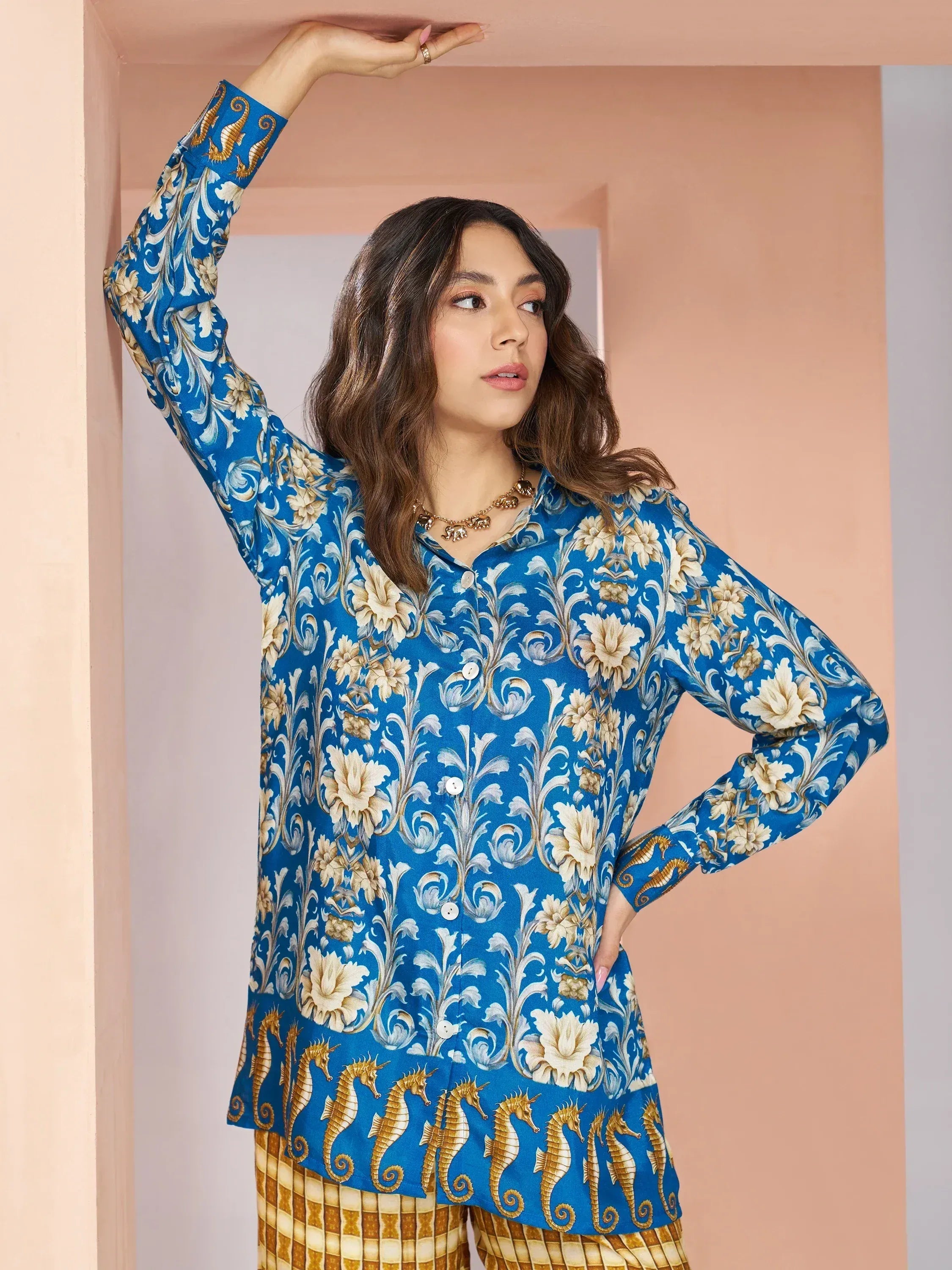 Blue floral and seahorse print ethnic kurta with gold accents, styled with patterned pants for women