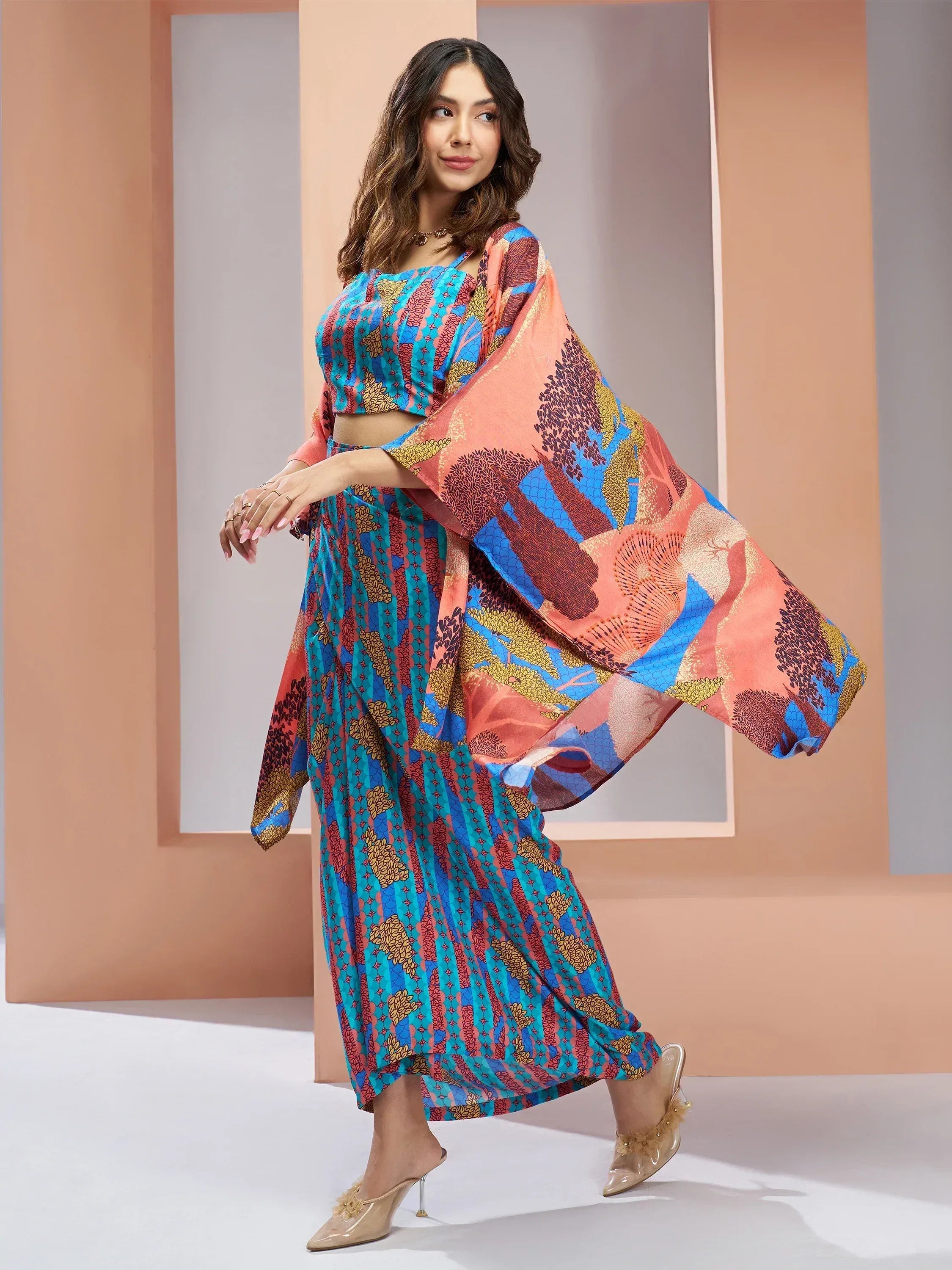 Woman in vibrant printed ethnic crop top and palazzo set with flowing dupatta, perfect for Indian occasions