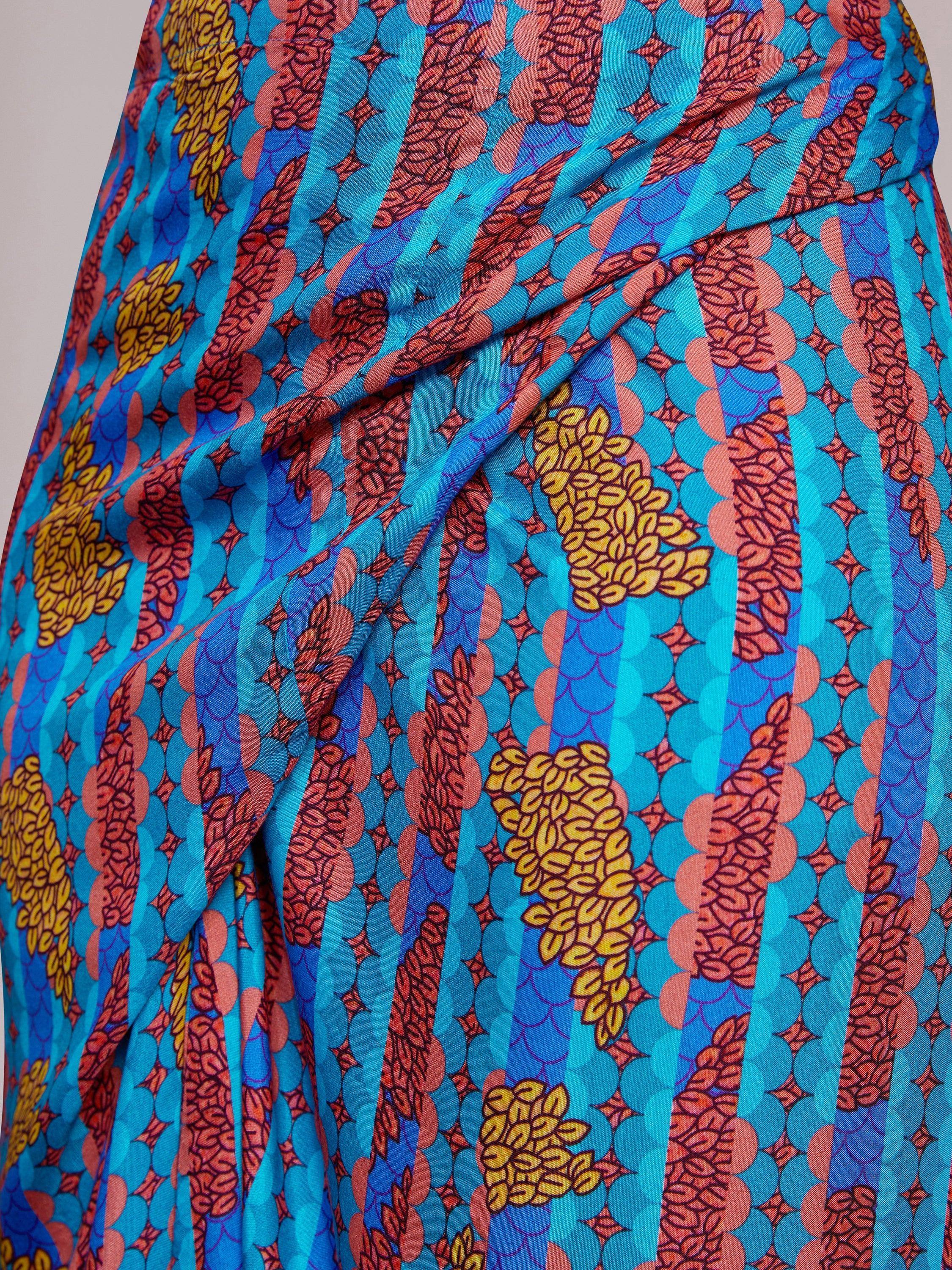 Vibrant blue ethnic gown with bold floral and geometric print, perfect for Indian occasions