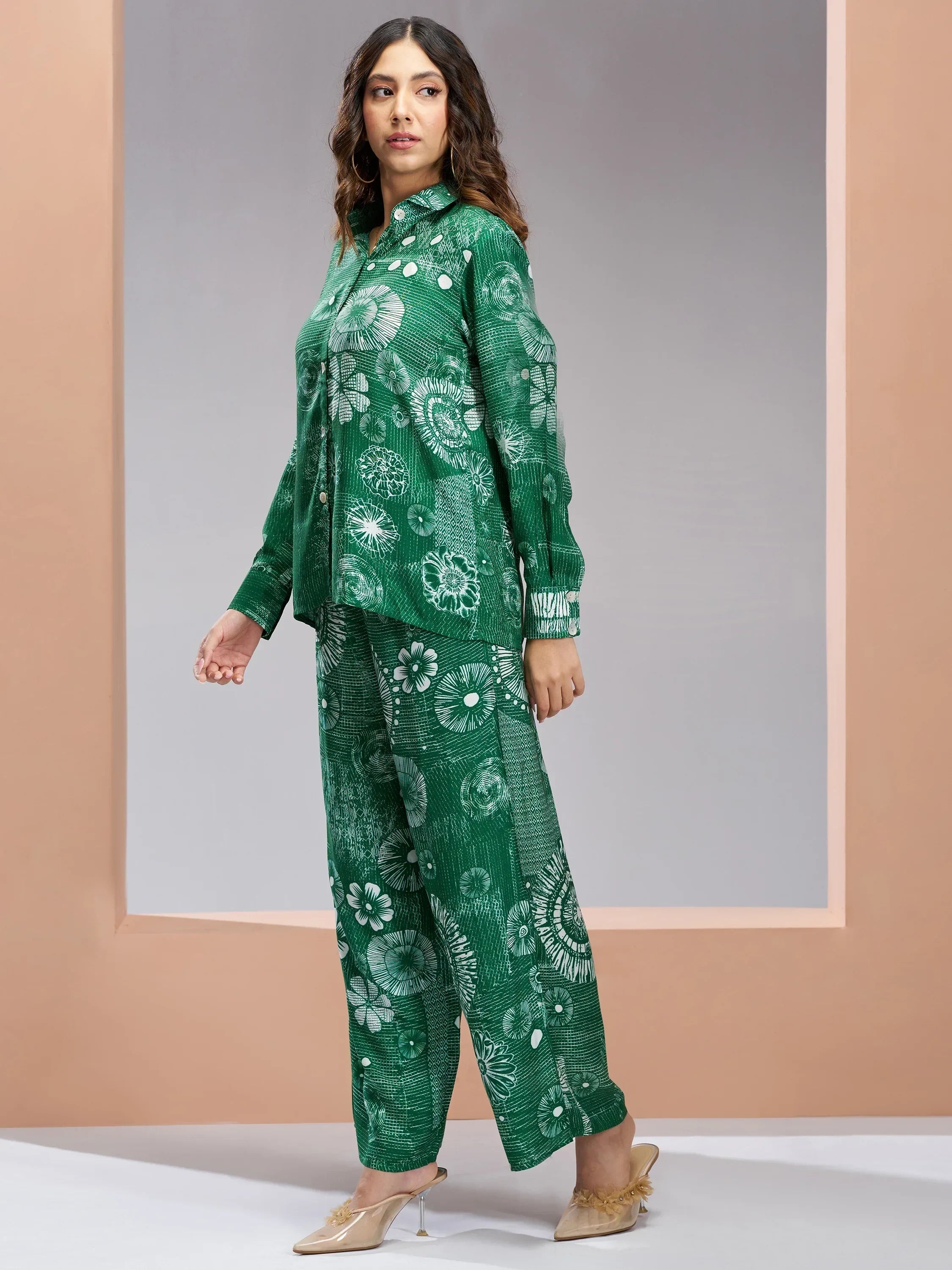 Woman wearing a green floral print kurta and pants set, modern ethnic outfit