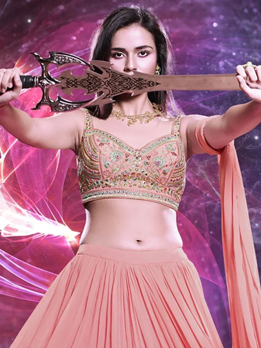 Woman in peach embroidered lehenga choli holding ornate sword, cosmic background
