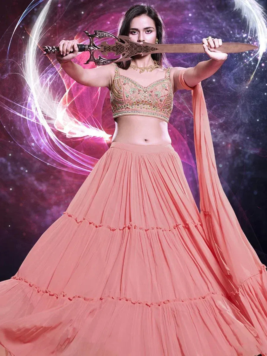 Woman in peach lehenga choli holding ornate sword against cosmic background, Indian ethnic wear