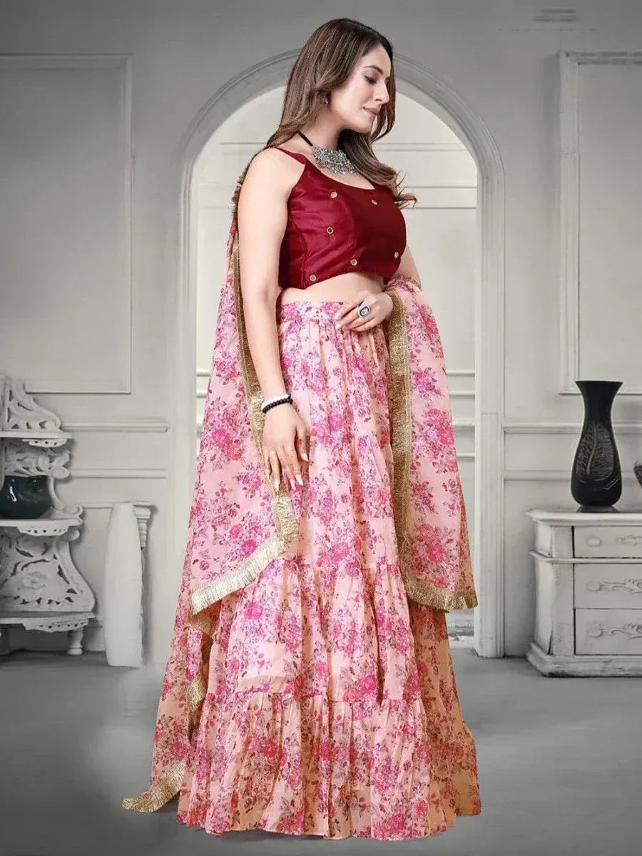Pink floral lehenga choli with maroon blouse, gold trim, and dupatta for Indian ethnic wear