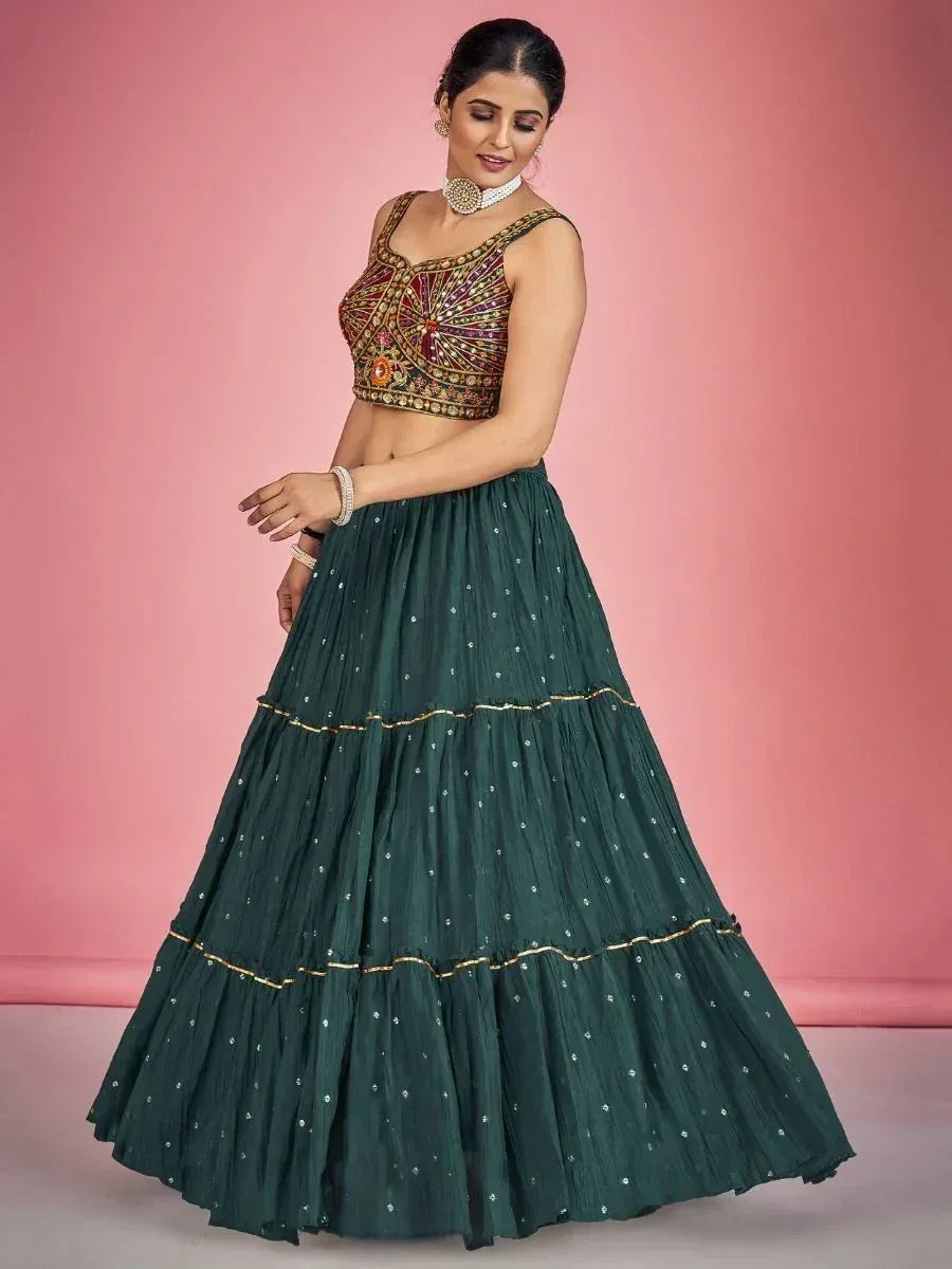 Emerald green tiered lehenga with embroidered blouse, perfect for Indian ethnic wear occasions
