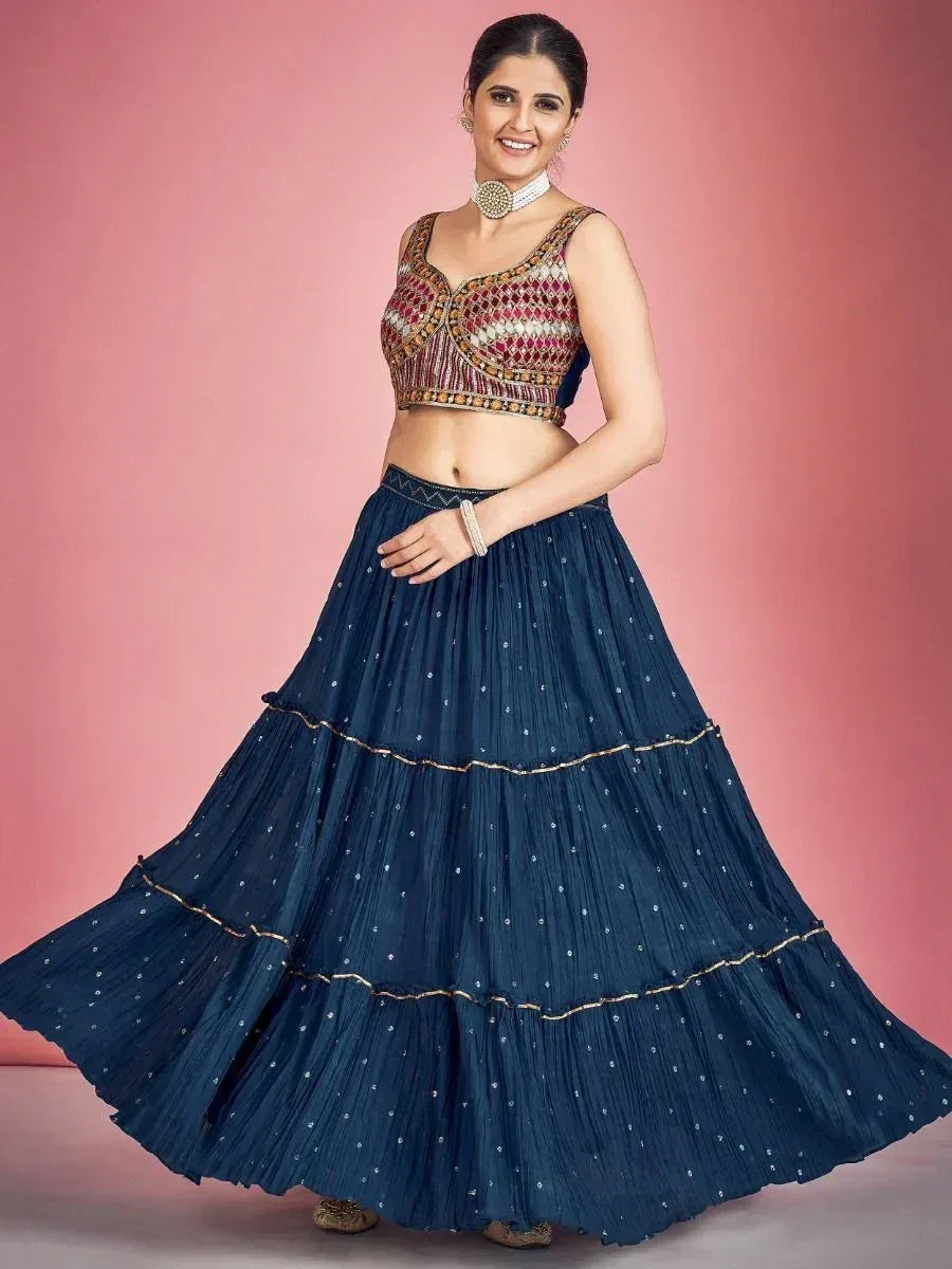 Woman in navy blue tiered lehenga with embroidered crop top, Indian ethnic wear