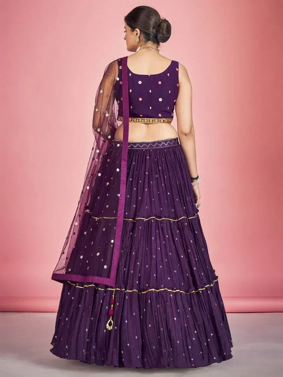 Purple designer lehenga choli with mirror work and gold trim, back view
