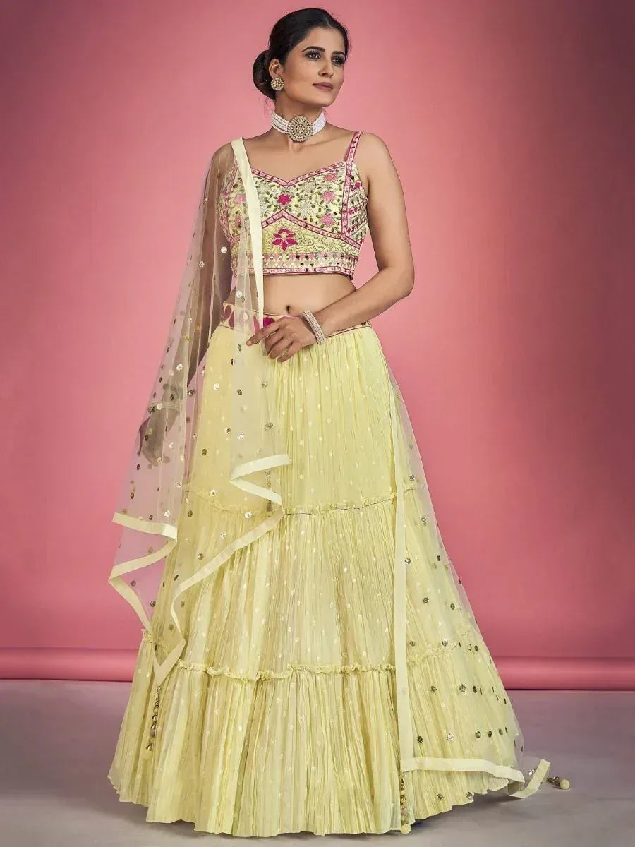 Yellow embroidered lehenga choli with floral blouse and sheer dupatta, perfect for Indian ethnic occasions