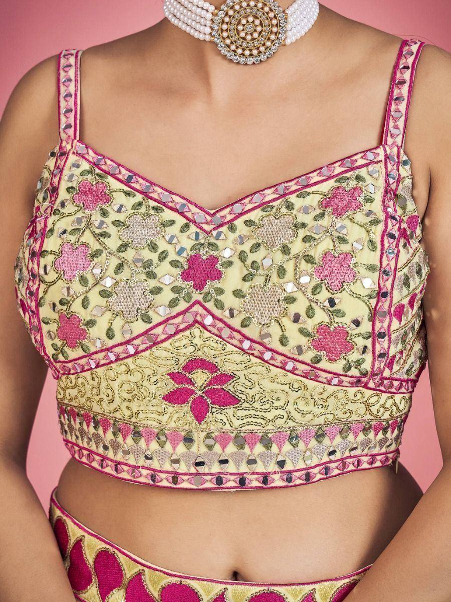 Pink and gold embroidered lehenga choli top with mirror work and floral design