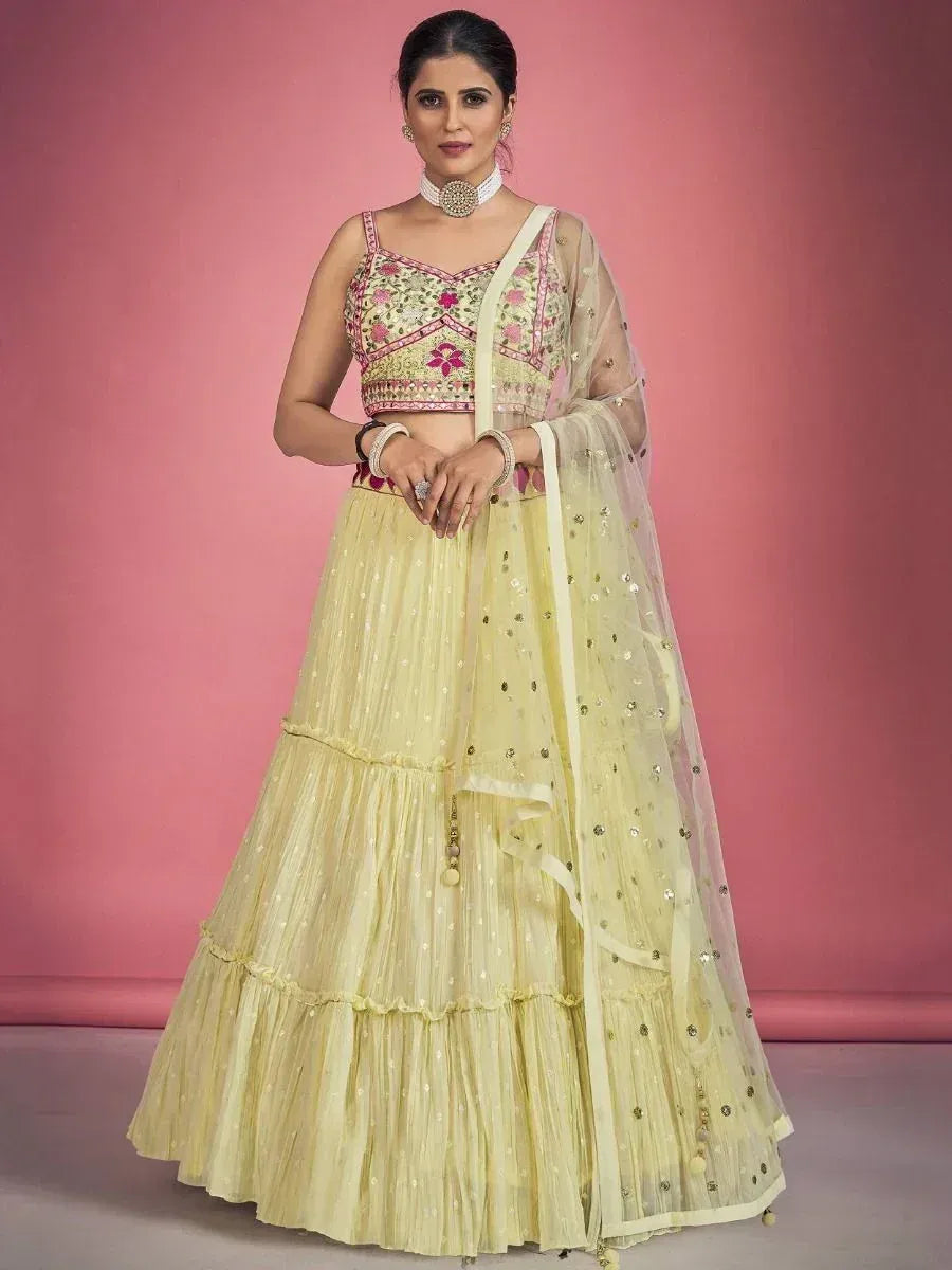 Yellow embroidered lehenga choli with floral blouse and sheer dupatta, perfect for Indian ethnic occasions
