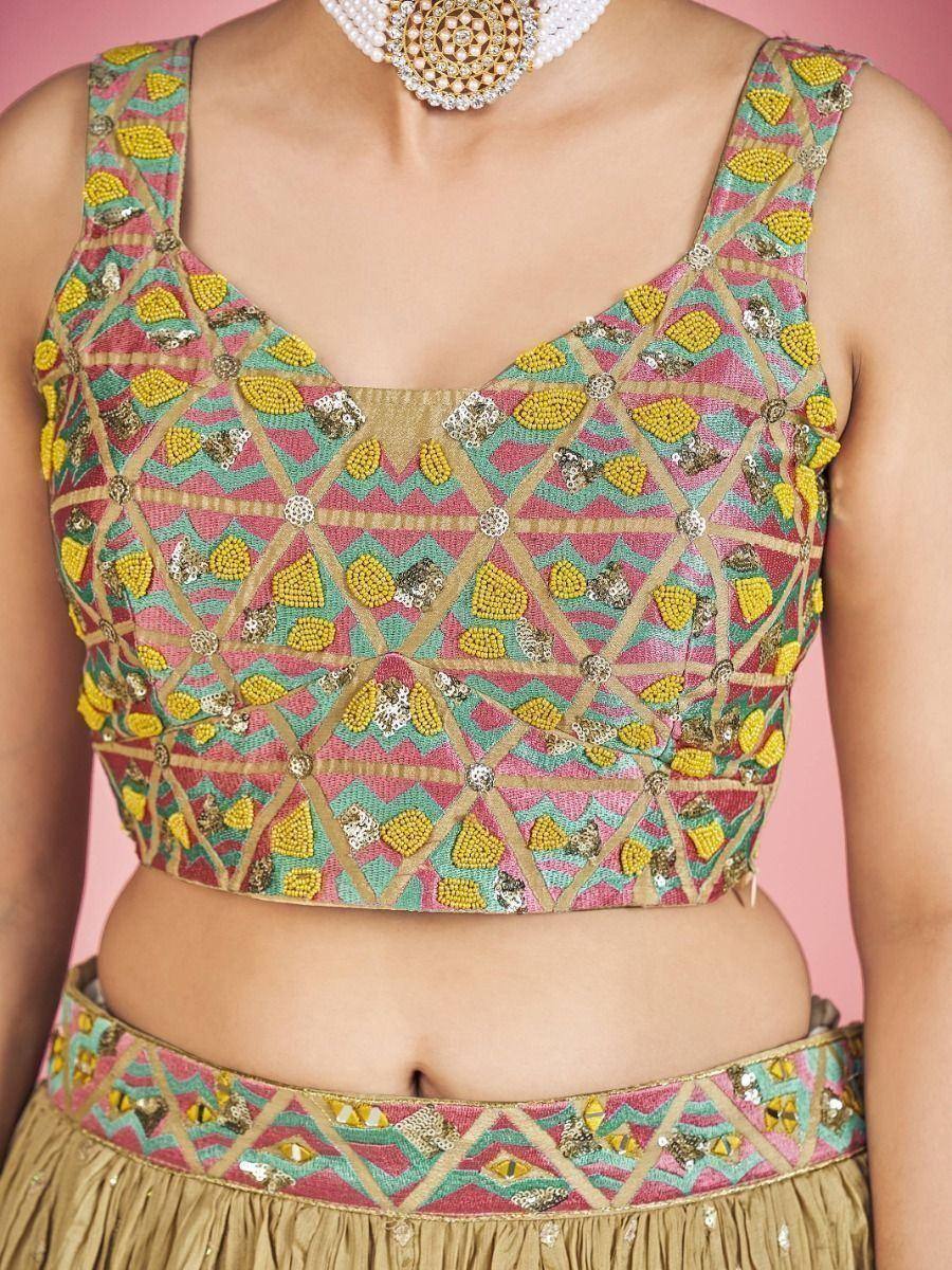 Colorful embroidered lehenga choli top with geometric beadwork and sequins, paired with matching waistband.