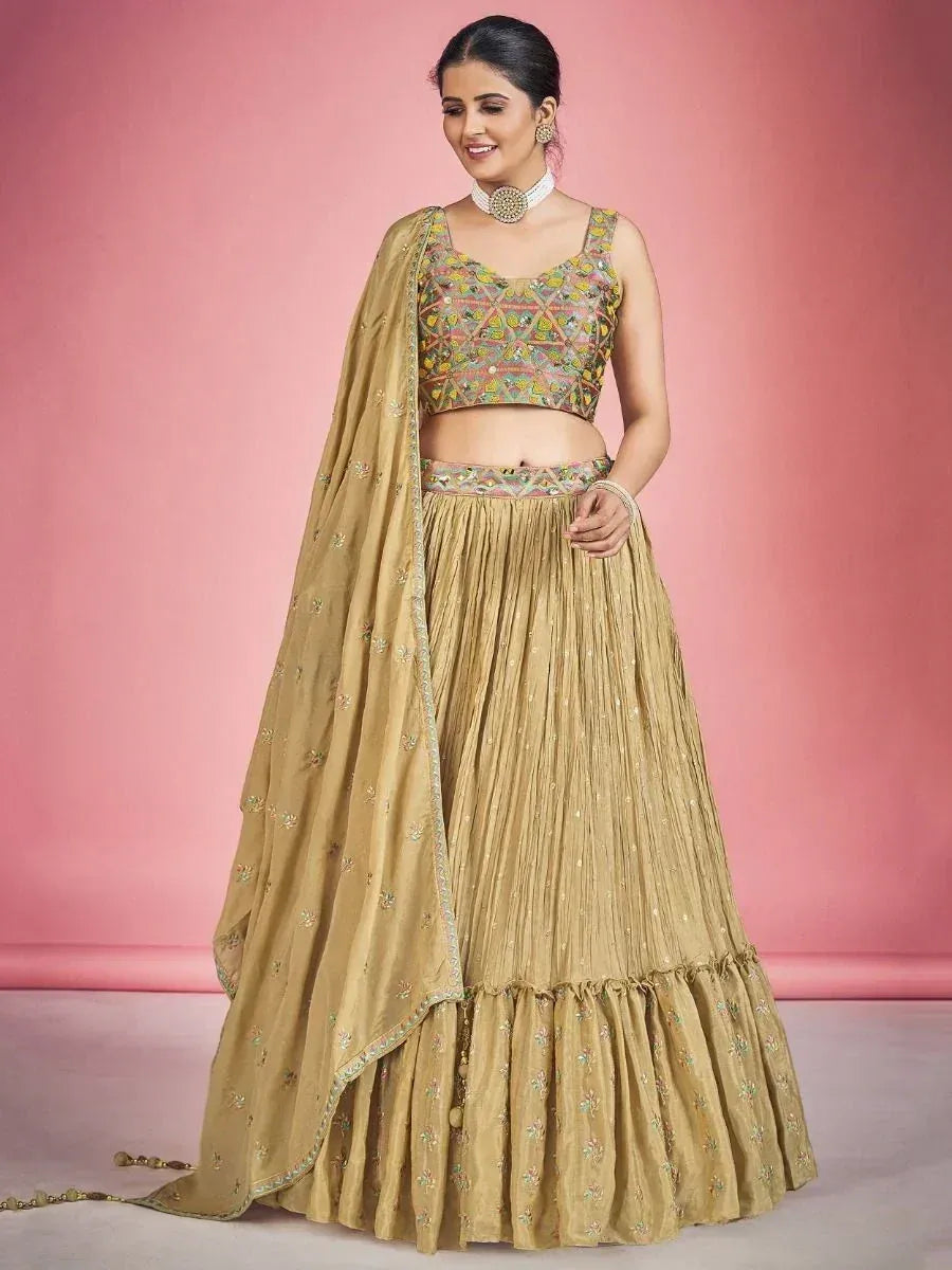 Golden embroidered lehenga choli with floral dupatta, perfect for Indian ethnic wear occasions